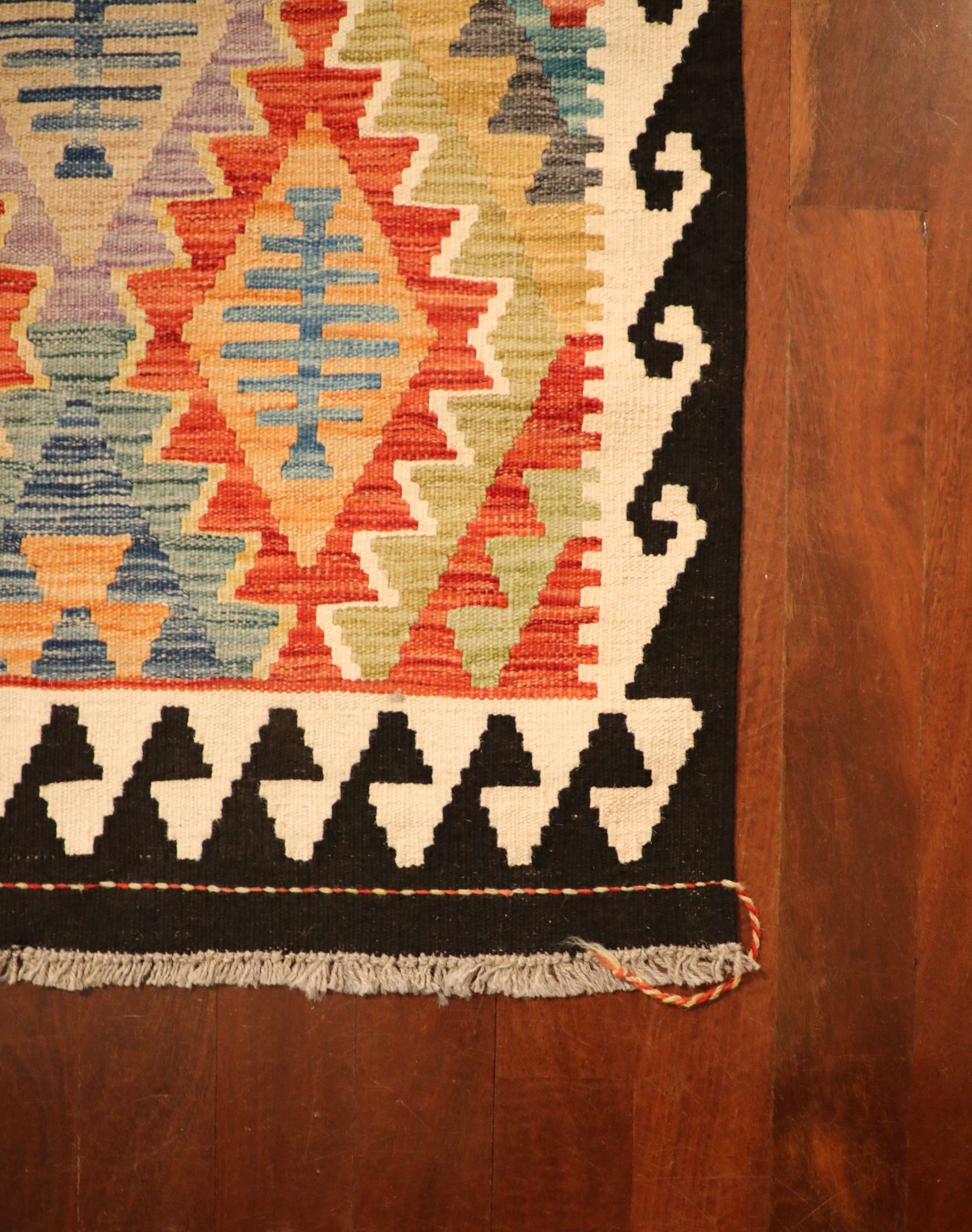 The Afghan Hand Woven Khyber Kilim Runner - 79 X 293.  Crafted using traditional vegetable dyed wool, and featuring traditional geometric designs. Colours, dark blue, creams, beiges, oranges, light greens and more. Measures 79 wide X 293 long. Corner.