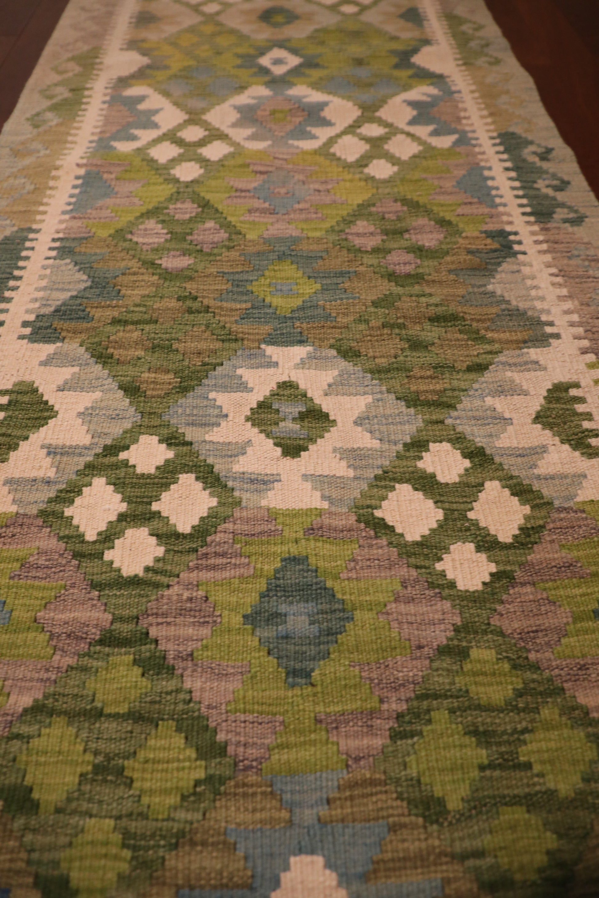 Khyber Kilim Rug Runner 82 X 312.  Hand woven wool with vegetable dyes.  Colours greens, greys and creams. Measures 82 wide x 312 length. Close.