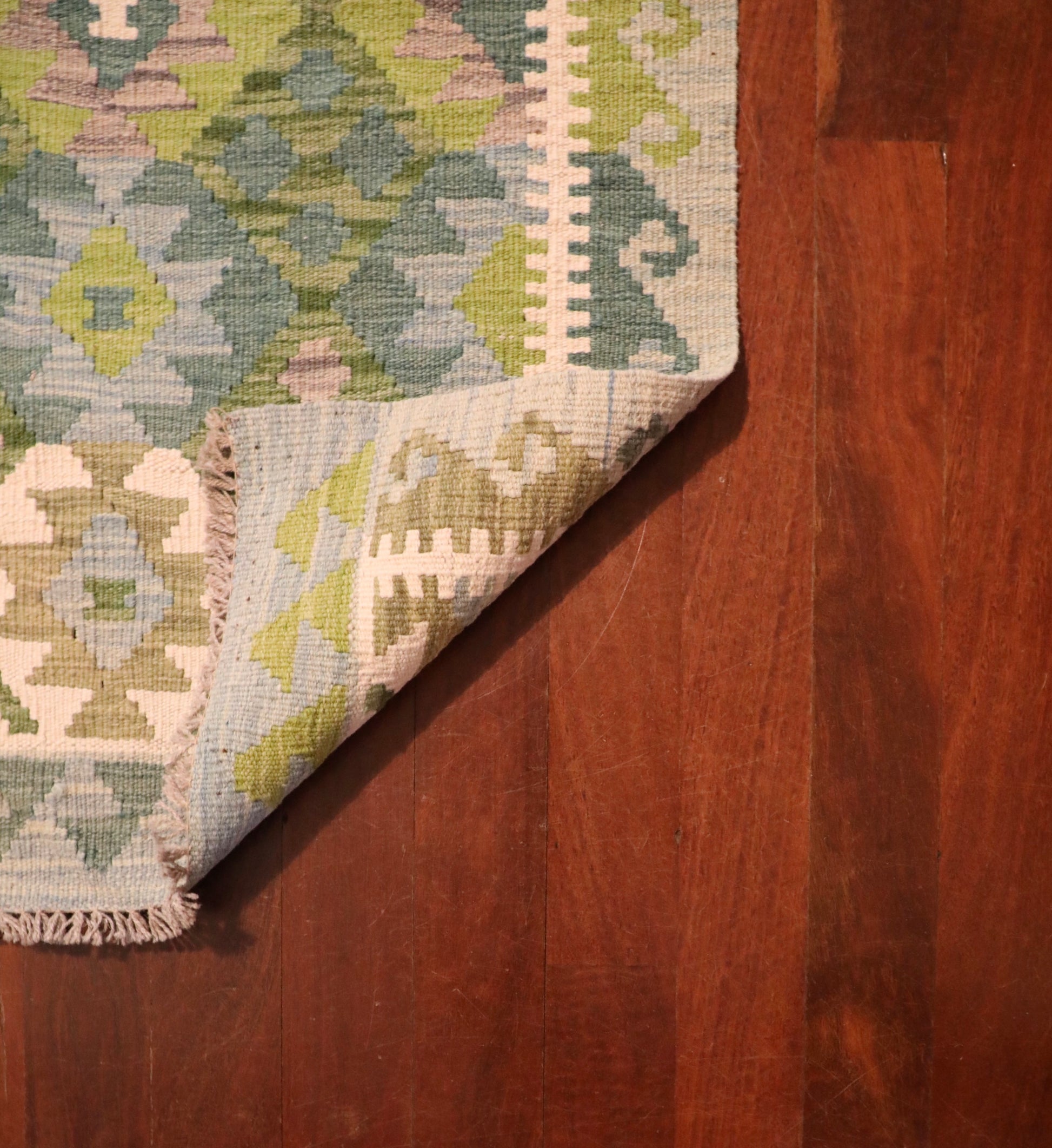 Khyber Kilim Rug Runner 82 X 312.  Hand woven wool with vegetable dyes.  Colours greens, greys and creams. Measures 82 wide x 312 length. Fold.