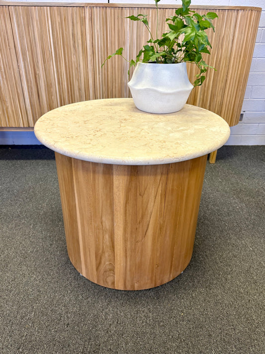 The Kobe Marble Top Side Table with a smooth round marble top and cylindrical teak wood base. Measures 600 diameter x 500 height.  Front Styled.