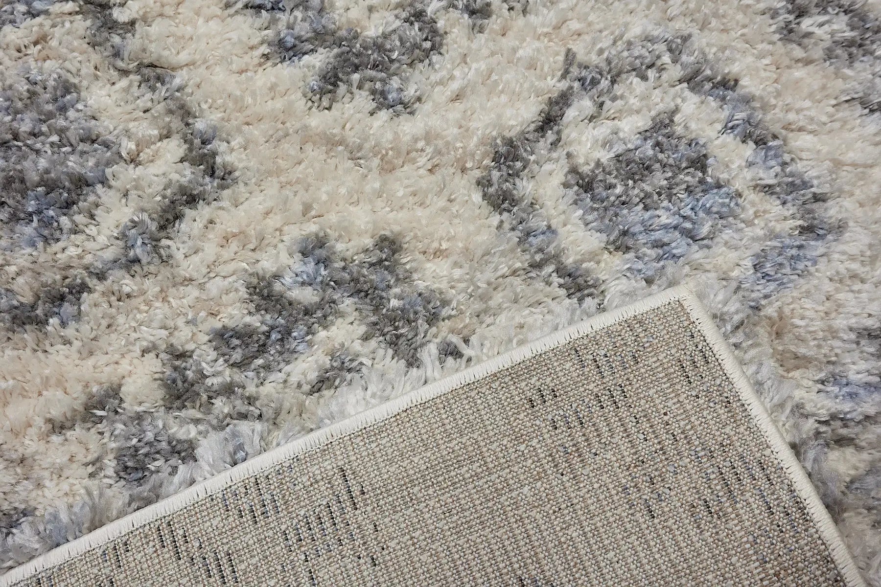 Konya Cream is a Moroccan/Boho inspiration rug.  Machine made of Polyester, this shaggy style rugs brings added soften textures.  Colours white and blue. Sizes 160 X 230, 200 X 290, 240 X 340 and 300 X 400. Fold.