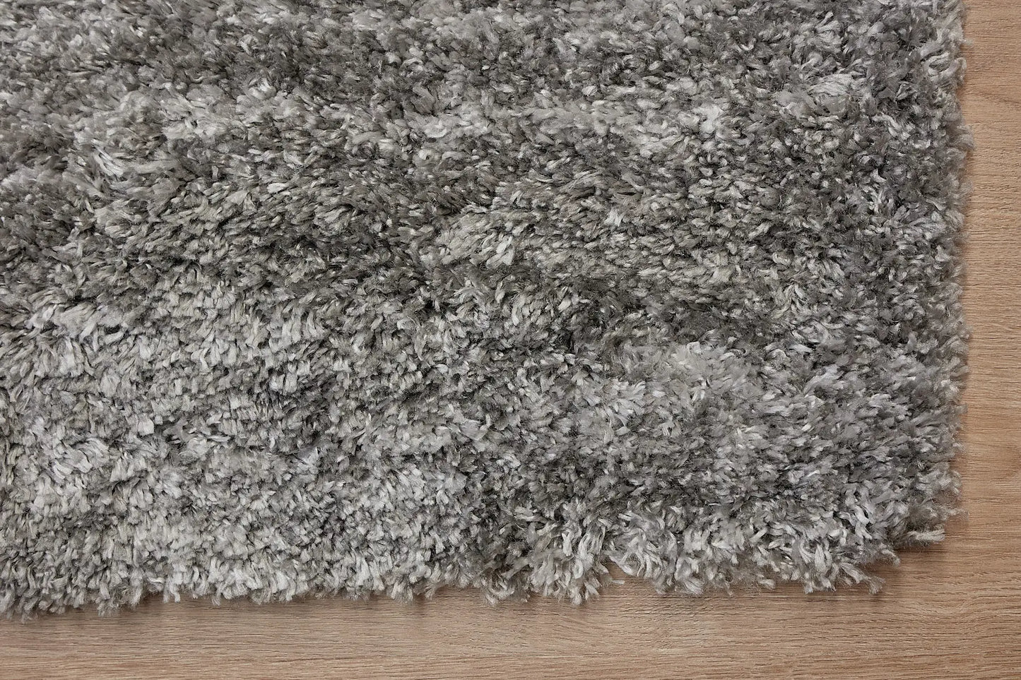 Konya Dark Grey is a Moroccan/Boho inspiration rug.  Machine made of Polyester, this shaggy style rugs brings added soften textures.  Colours Dark Grey, Grey and Light Grey. Sizes 160 X 230, 200 X 290, 240 X 340 and 300 X 400. Corner.