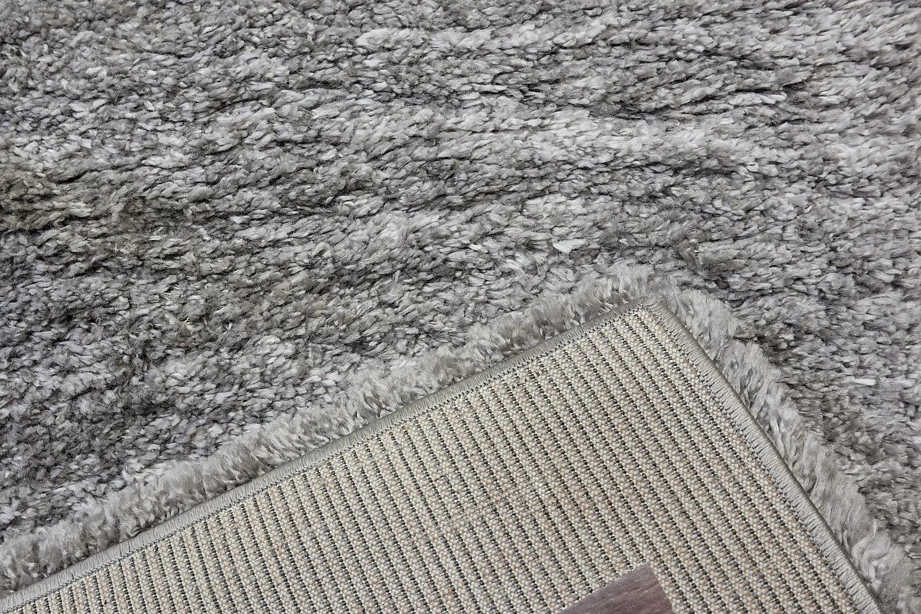 Konya Dark Grey is a Moroccan/Boho inspiration rug.  Machine made of Polyester, this shaggy style rugs brings added soften textures.  Colours Dark Grey, Grey and Light Grey. Sizes 160 X 230, 200 X 290, 240 X 340 and 300 X 400. Fold.