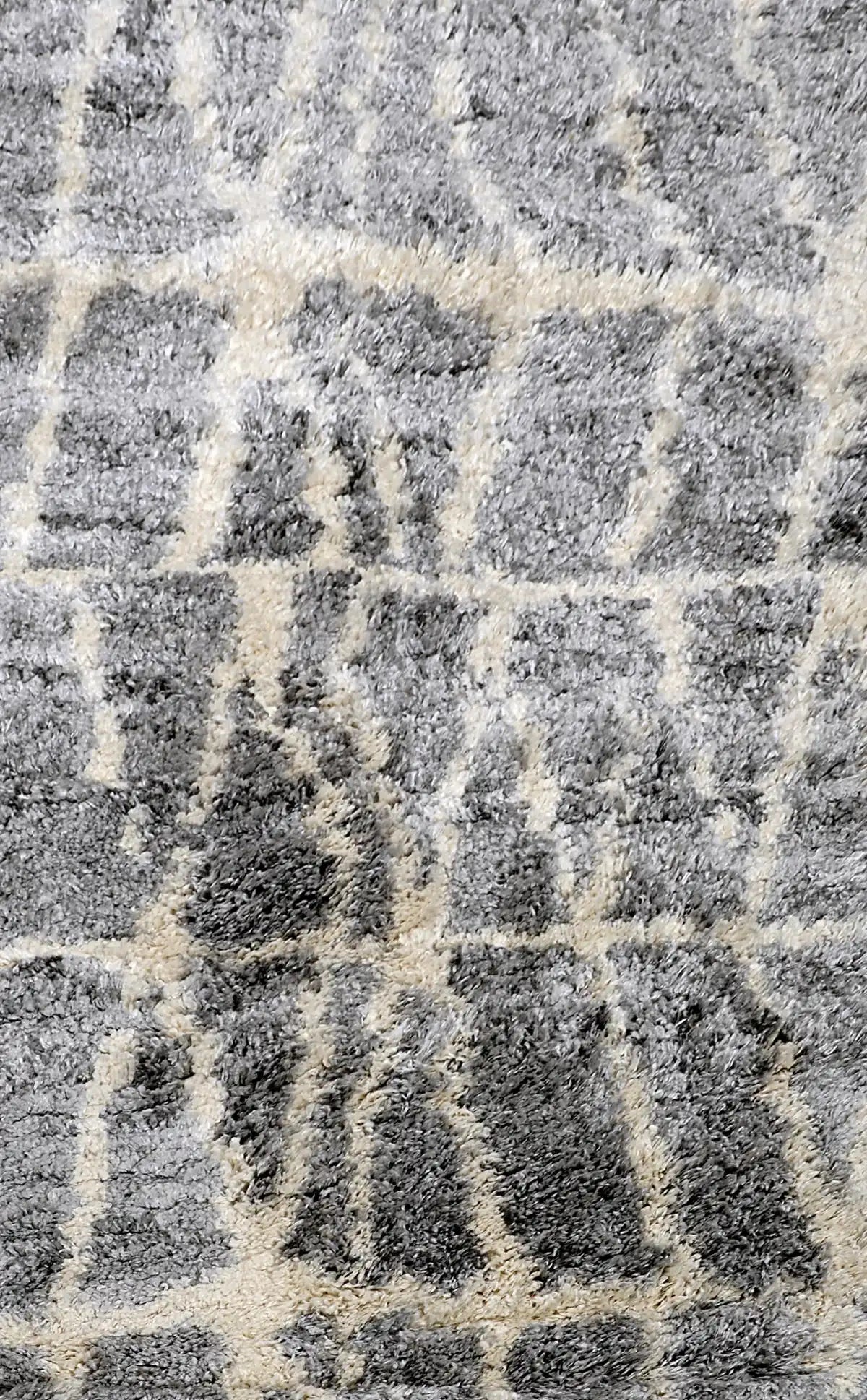 Konya Grey is a Moroccan/Boho inspiration rug.  Machine made of Polyester, this shaggy style rugs brings added soften textures.  Colours Grey, White and Light Grey. Sizes 160 X 230, 200 X 290, 240 X 340 and 300 X 400. Full.