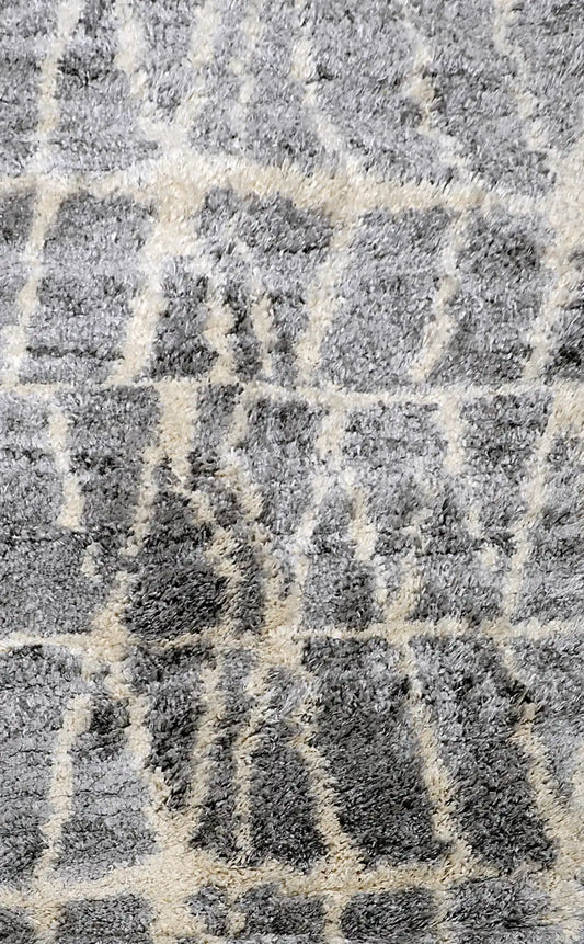 Konya Grey is a Moroccan/Boho inspiration rug.  Machine made of Polyester, this shaggy style rugs brings added soften textures.  Colours Grey, White and Light Grey. Sizes 160 X 230, 200 X 290, 240 X 340 and 300 X 400. Full.