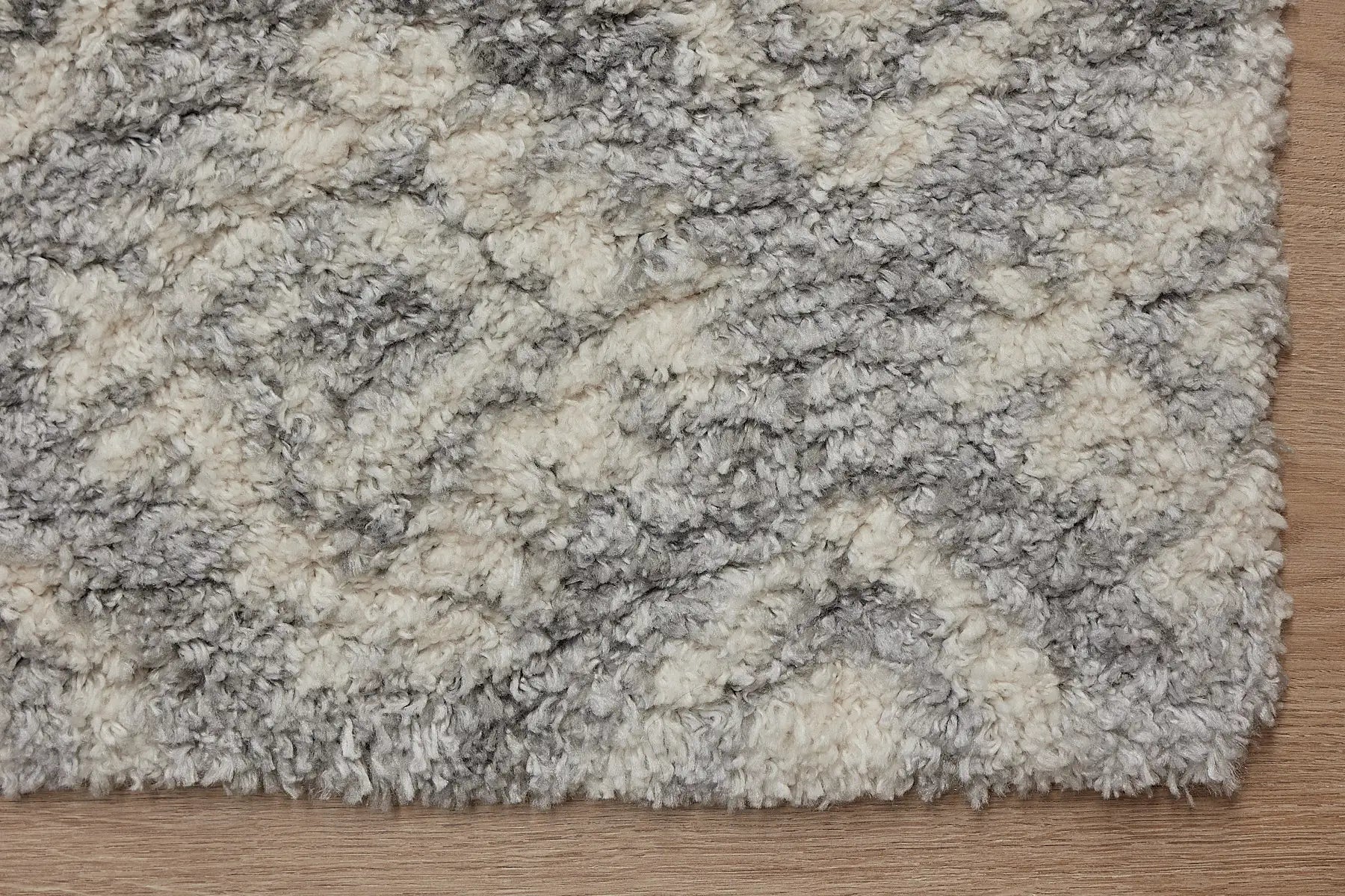 Konya Geo is a Moroccan/Boho inspiration rug.  Machine made of Polyester, this shaggy style rugs brings added soften textures.  Colours Blue, White and Light Grey. Sizes 160 X 230, 200 X 290, 240 X 340 and 300 X 400. Corner.