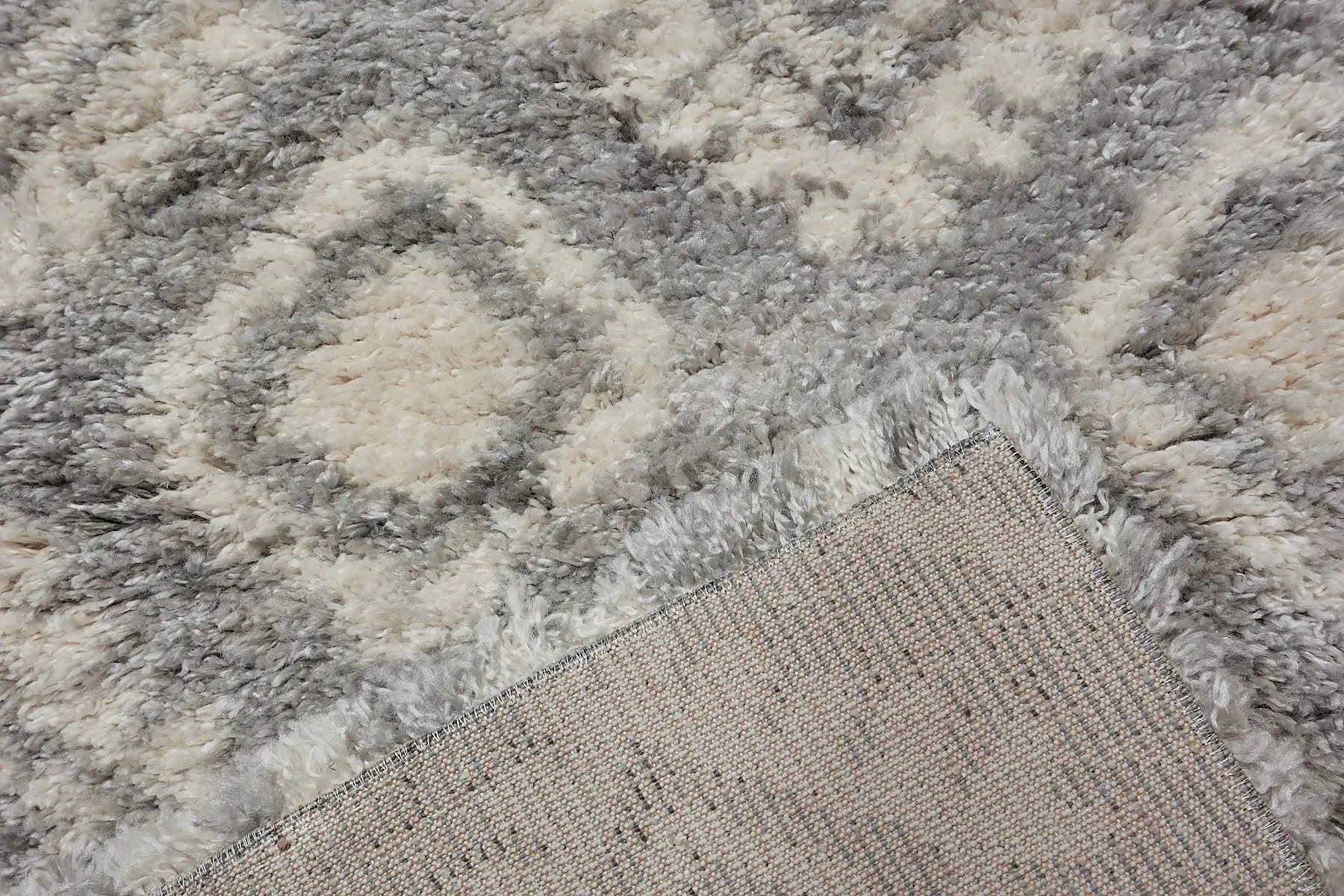 Konya Geo is a Moroccan/Boho inspiration rug.  Machine made of Polyester, this shaggy style rugs brings added soften textures.  Colours Blue, White and Light Grey. Sizes 160 X 230, 200 X 290, 240 X 340 and 300 X 400. Fold.
