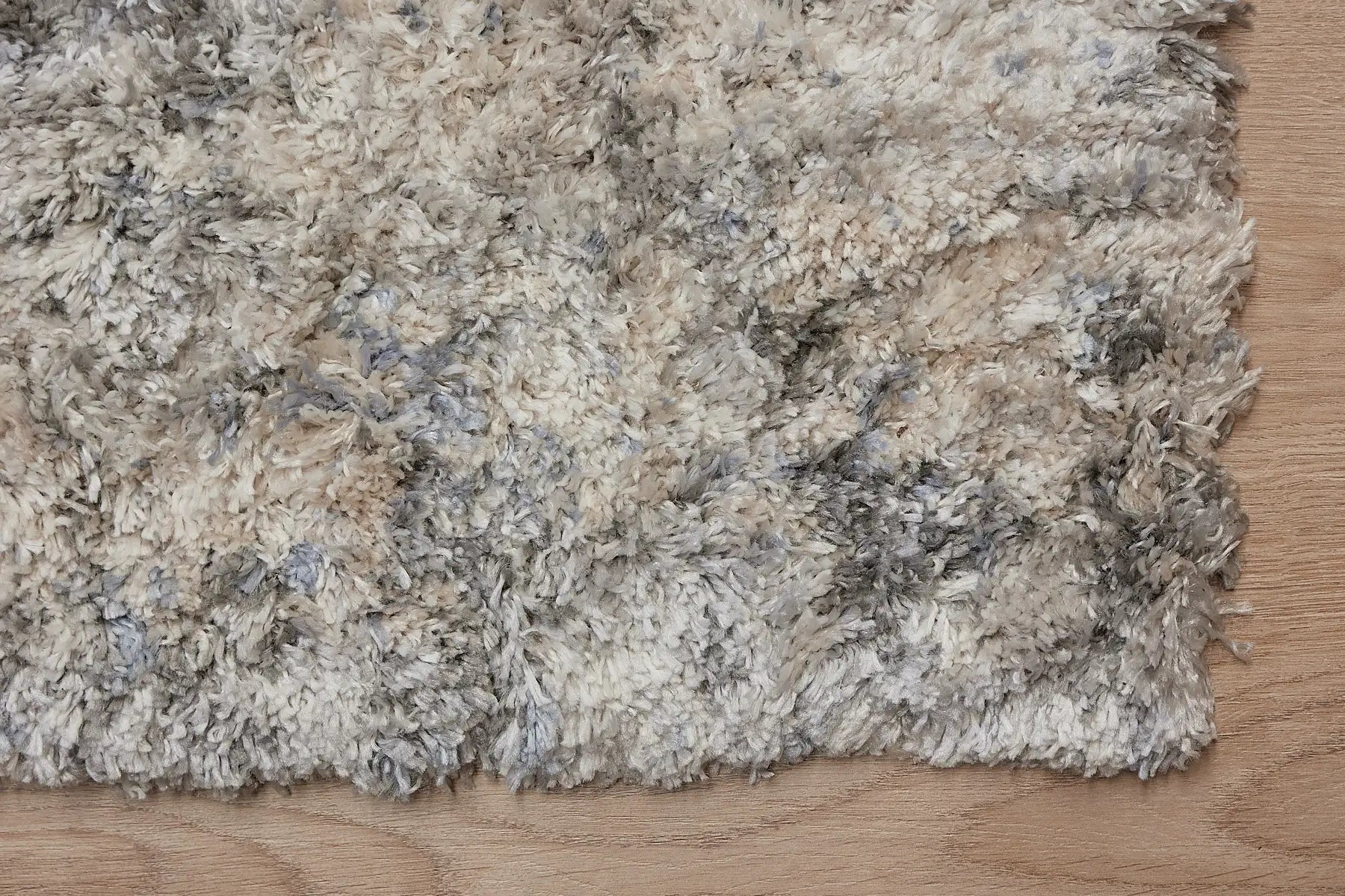 Konya Ice is a Moroccan/Boho inspiration rug.  Machine made of Polyester, this shaggy style rugs brings added soften textures.  Colours Grey, White, Beige and Light Grey. Sizes 160 X 230, 200 X 290, 240 X 340 and 300 X 400. Corner.