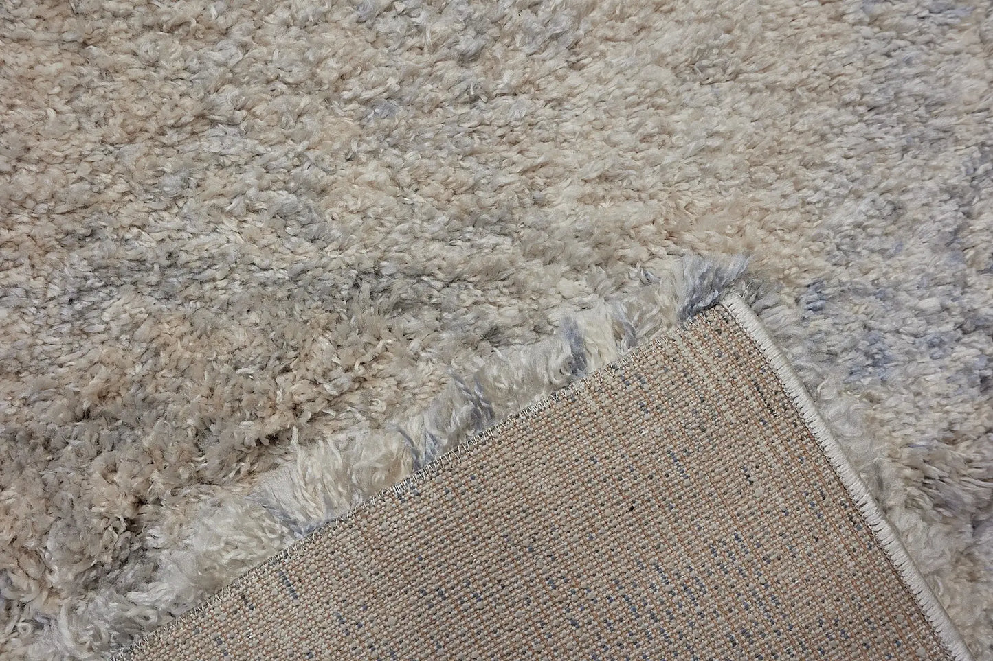 Konya Ice is a Moroccan/Boho inspiration rug.  Machine made of Polyester, this shaggy style rugs brings added soften textures.  Colours Grey, White, Beige and Light Grey. Sizes 160 X 230, 200 X 290, 240 X 340 and 300 X 400. Fold.