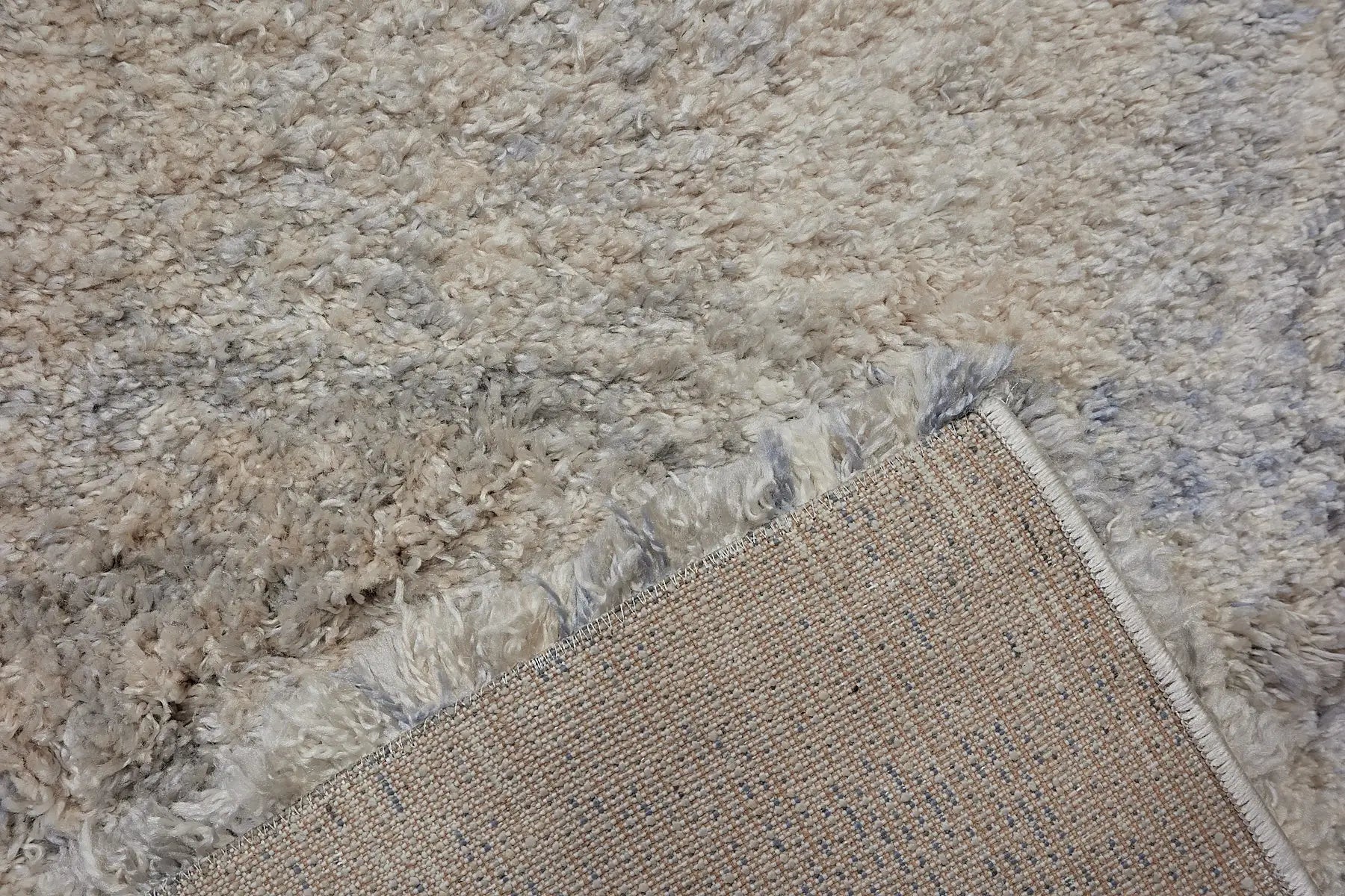 Konya Ice is a Moroccan/Boho inspiration rug.  Machine made of Polyester, this shaggy style rugs brings added soften textures.  Colours Grey, White, Beige and Light Grey. Sizes 160 X 230, 200 X 290, 240 X 340 and 300 X 400. Fold.