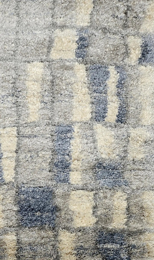 Konya Recta is a Moroccan/Boho inspiration rug.  Machine made of Polyester, this shaggy style rugs brings added soften textures.  Colours Grey, White, Blue and Light Grey. Sizes 160 X 230, 200 X 290, 240 X 340 and 300 X 400. Full.
