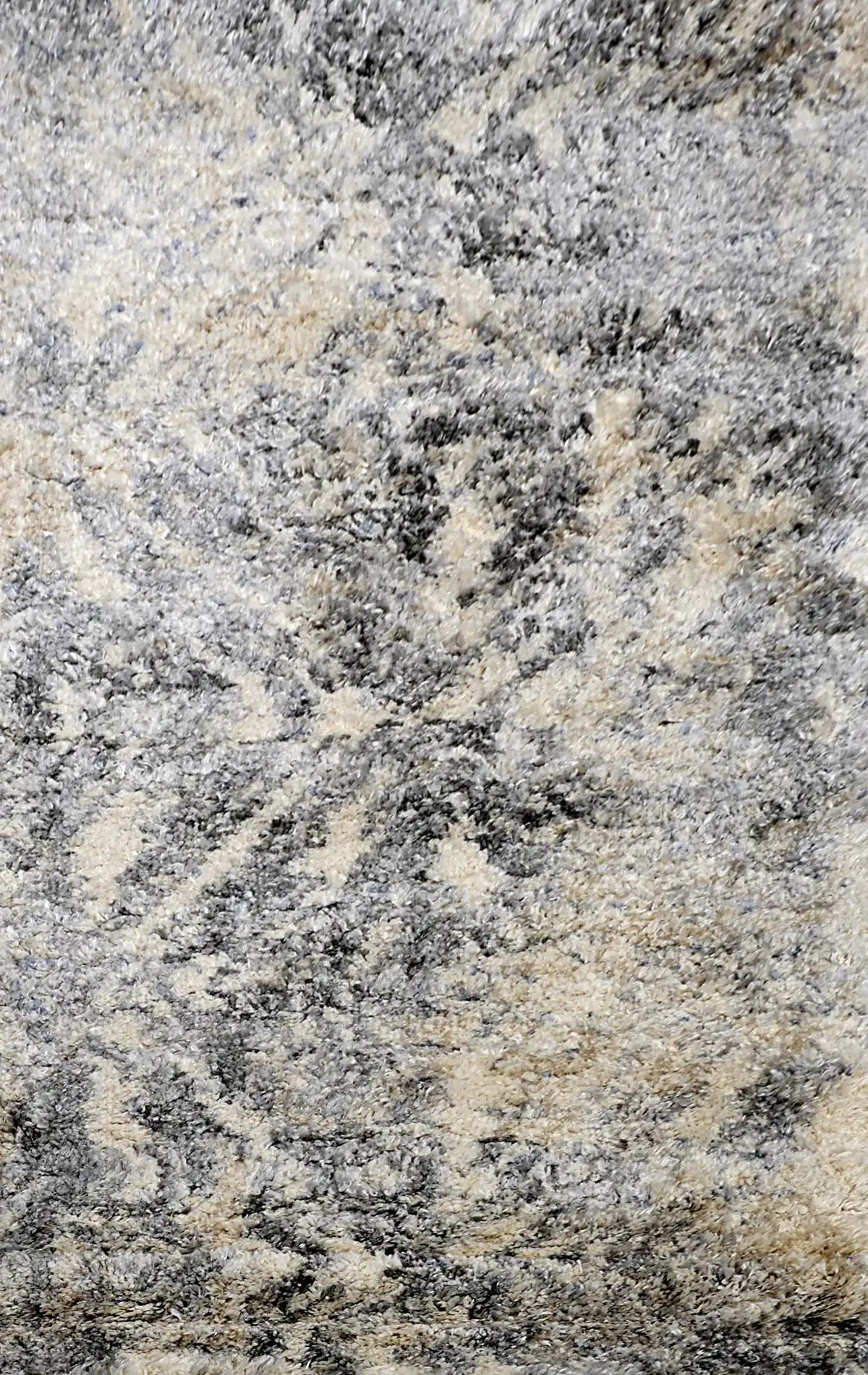 Konya Silver is a Moroccan/Boho inspiration rug.  Machine made of Polyester, this shaggy style rugs brings added soften textures.  Colours Grey, White, Beige and Light Grey. Sizes 160 X 230, 200 X 290, 240 X 340 and 300 X 400. Full.