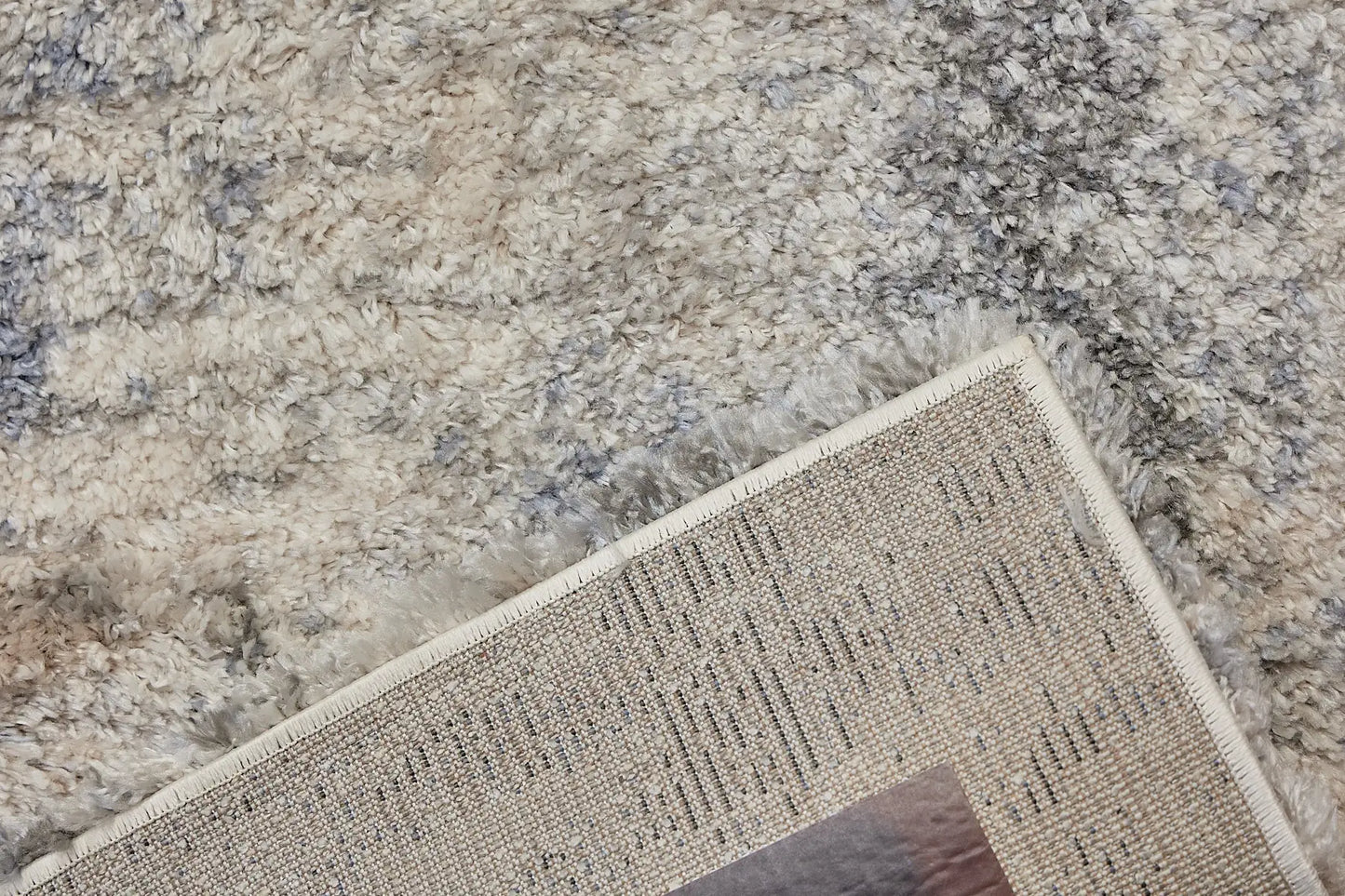 Konya Sand is a Moroccan/Boho inspiration rug.  Machine made of Polyester, this shaggy style rugs brings added soften textures.  Colours Grey, White, Beige and Light Grey. Sizes 160 X 230, 200 X 290, 240 X 340 and 300 X 400. Fold.