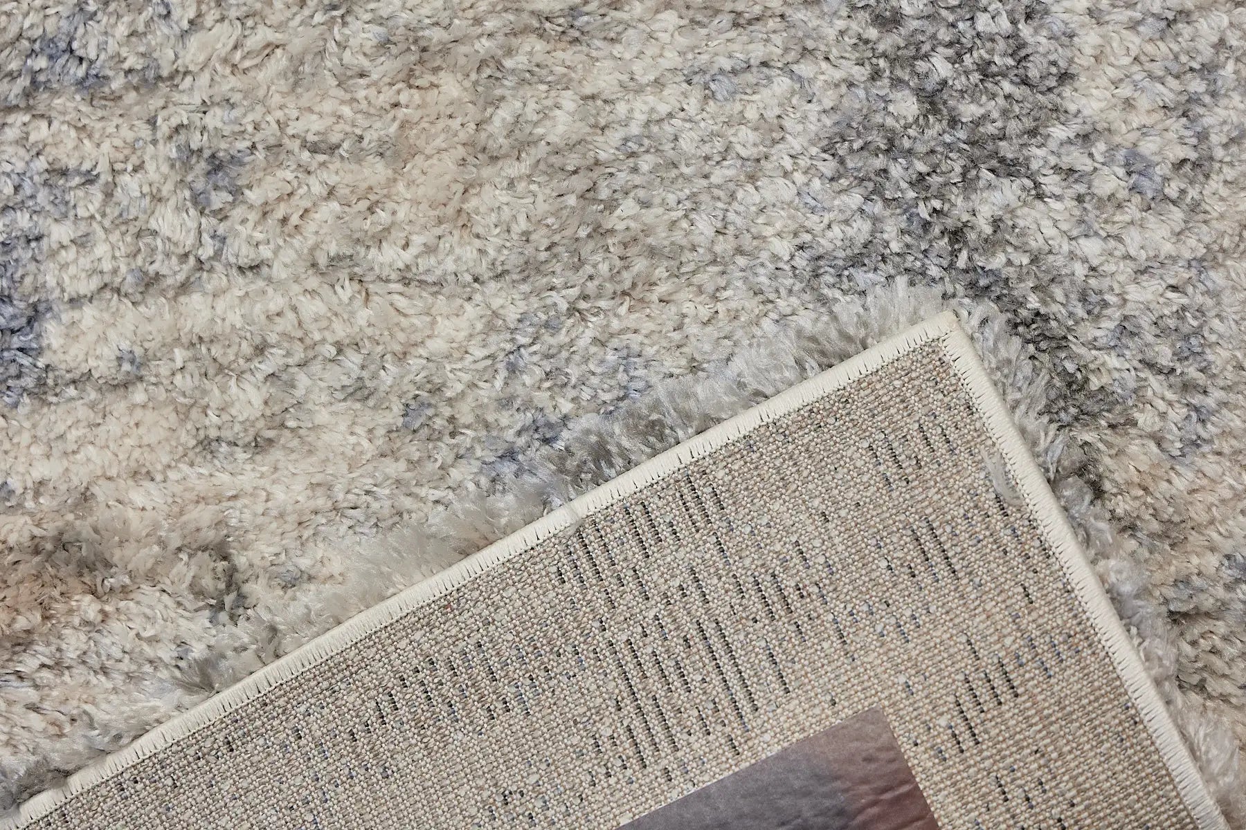 Konya Sand is a Moroccan/Boho inspiration rug.  Machine made of Polyester, this shaggy style rugs brings added soften textures.  Colours Grey, White, Beige and Light Grey. Sizes 160 X 230, 200 X 290, 240 X 340 and 300 X 400. Fold.