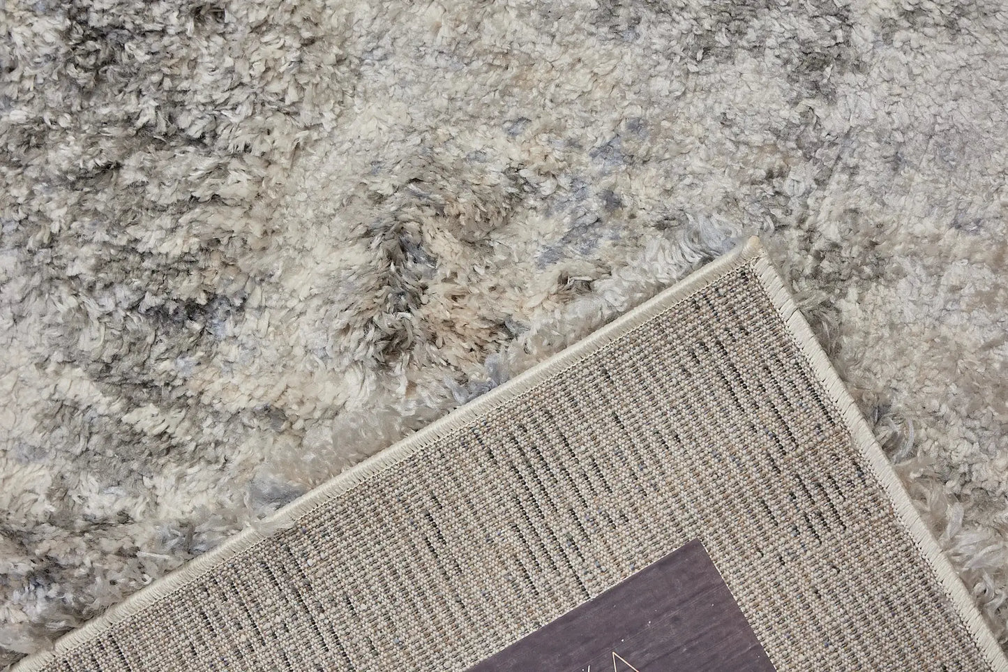 Konya Silver is a Moroccan/Boho inspiration rug.  Machine made of Polyester, this shaggy style rugs brings added soften textures.  Colours Grey, White, Beige and Light Grey. Sizes 160 X 230, 200 X 290, 240 X 340 and 300 X 400. Fold.