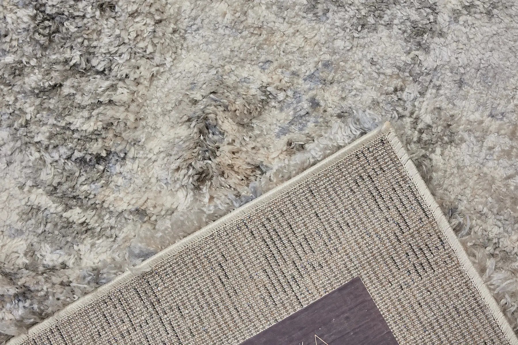 Konya Silver is a Moroccan/Boho inspiration rug.  Machine made of Polyester, this shaggy style rugs brings added soften textures.  Colours Grey, White, Beige and Light Grey. Sizes 160 X 230, 200 X 290, 240 X 340 and 300 X 400. Fold.