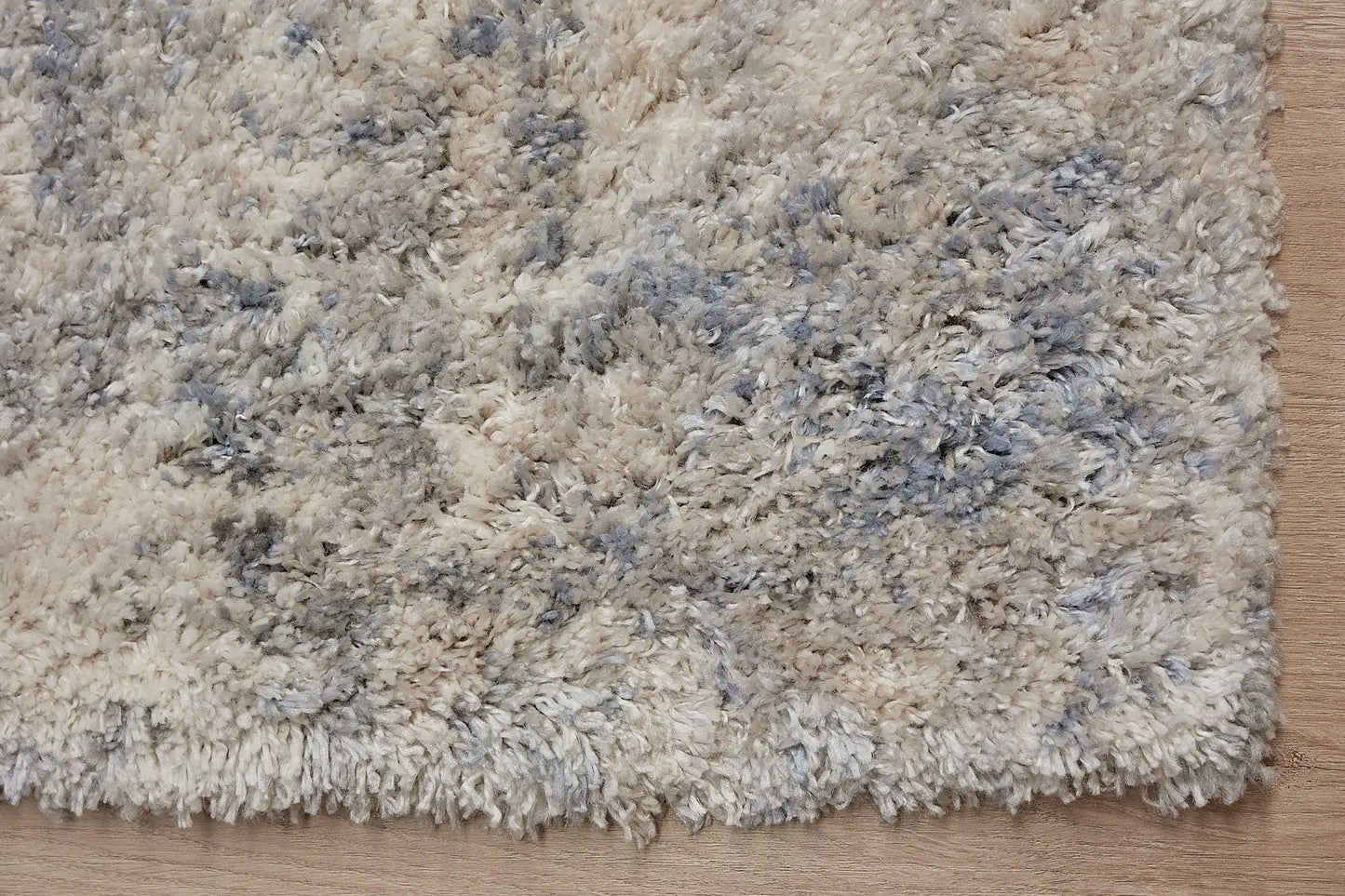 Konya Taupe is a Moroccan/Boho inspiration rug.  Machine made of Polyester, this shaggy style rugs brings added soften textures.  Colours Grey, White, and Light Grey. Sizes 160 X 230, 200 X 290, 240 X 340 and 300 X 400. Corner.