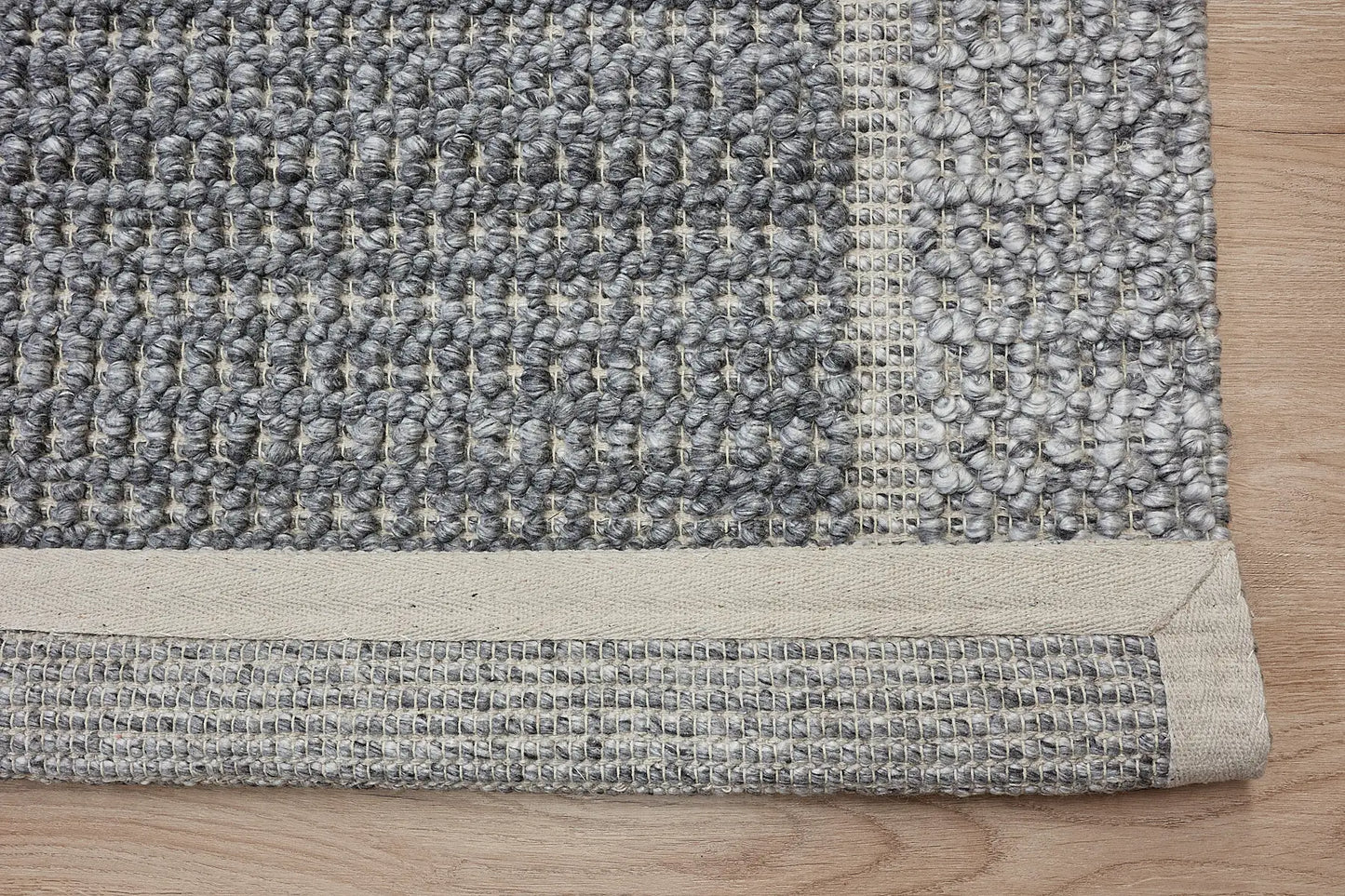 Liberty Ash is an eco-luxury rug crafted with hand woven recycled PET (plastic bottles) yarn. Boasting a super soft textured loop pile and pile height of 16-18mm. Colour Grey and Light Grey. Sizes 160 X 230, 200 X 290, 240 X 340 and 290 X 390. Fold.