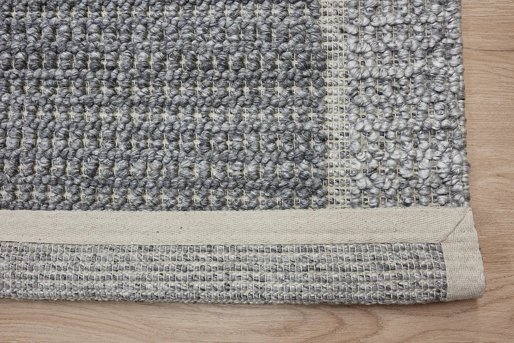 Liberty Ash is an eco-luxury rug crafted with hand woven recycled PET (plastic bottles) yarn. Boasting a super soft textured loop pile and pile height of 16-18mm. Colour Grey and Light Grey. Sizes 160 X 230, 200 X 290, 240 X 340 and 290 X 390. Fold.