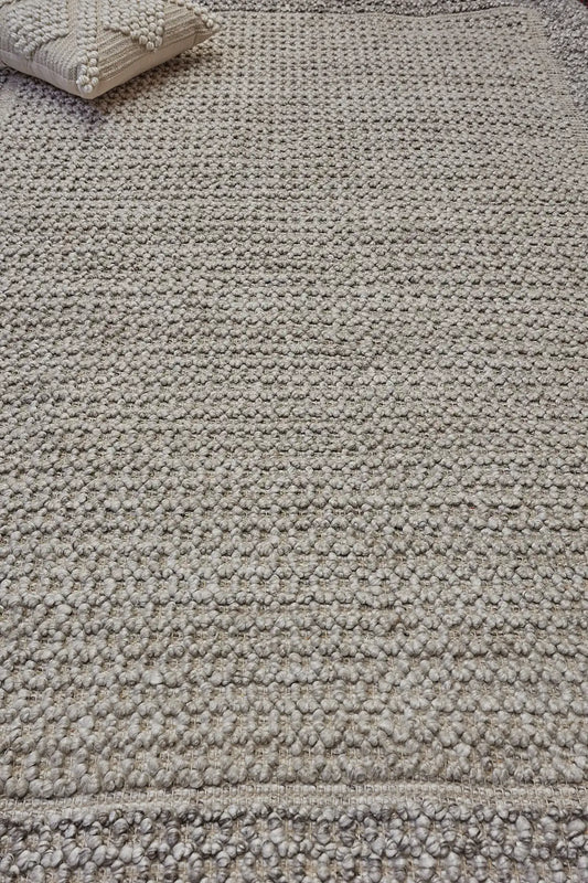 Liberty Limestone is an eco-luxury rug crafted with hand woven recycled PET (plastic bottles) yarn. Boasting a super soft textured loop pile and pile height of 16-18mm. Colour Light Grey and Beige Grey. Sizes 160 X 230, 200 X 290, 240 X 340 and 290 X 390. Life.
