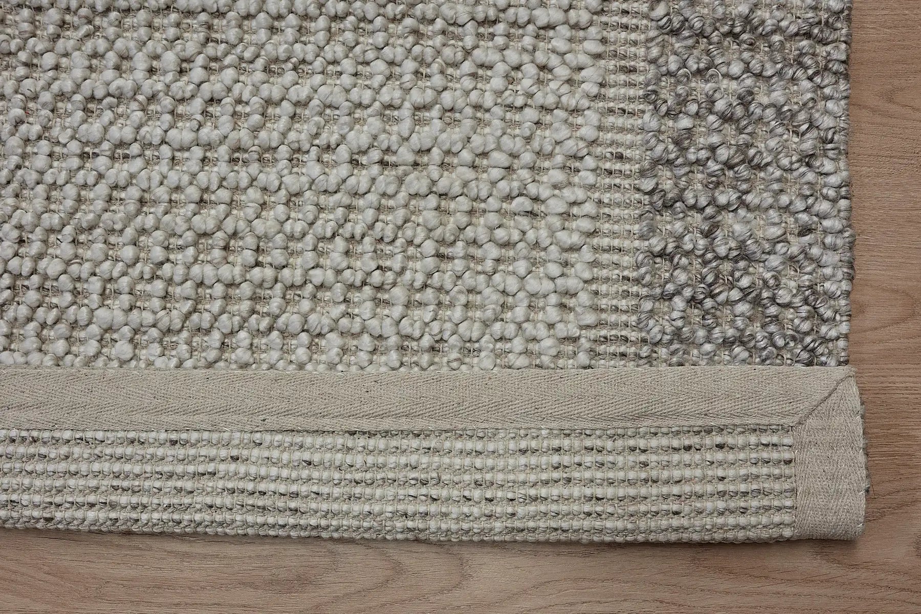 Liberty Limestone is an eco-luxury rug crafted with hand woven recycled PET (plastic bottles) yarn. Boasting a super soft textured loop pile and pile height of 16-18mm. Colour Light Grey and Beige Grey. Sizes 160 X 230, 200 X 290, 240 X 340 and 290 X 390. Fold.