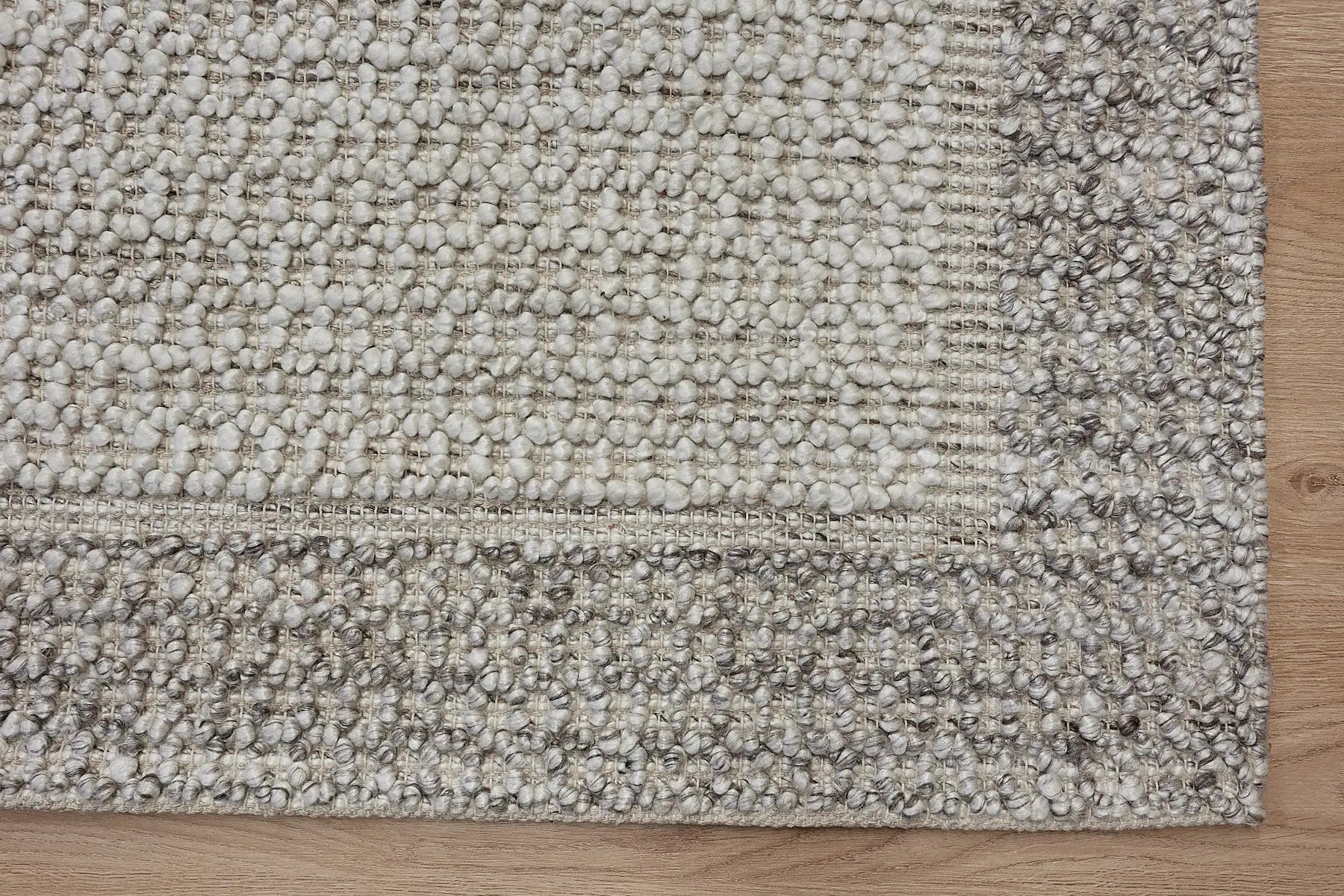 Liberty Oatmeal is an eco-luxury rug crafted with hand woven recycled PET (plastic bottles) yarn. Boasting a super soft textured loop pile and pile height of 16-18mm. Colour Light Grey and Cream Grey. Sizes 160 X 230, 200 X 290, 240 X 340 and 290 X 390. Corner.