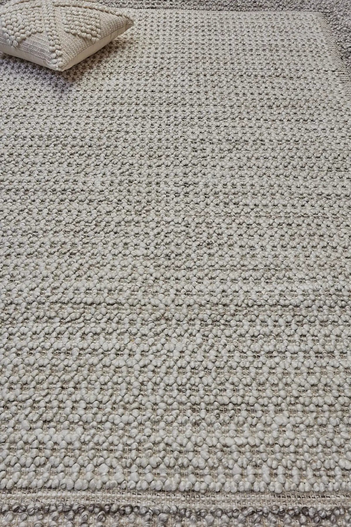 Liberty Oatmeal is an eco-luxury rug crafted with hand woven recycled PET (plastic bottles) yarn. Boasting a super soft textured loop pile and pile height of 16-18mm. Colour Light Grey and Cream Grey. Sizes 160 X 230, 200 X 290, 240 X 340 and 290 X 390. Life.