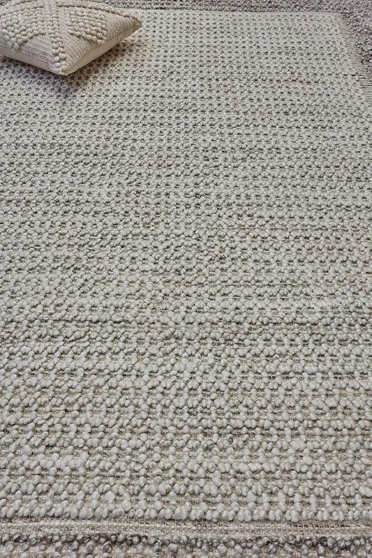 Liberty Oatmeal is an eco-luxury rug crafted with hand woven recycled PET (plastic bottles) yarn. Boasting a super soft textured loop pile and pile height of 16-18mm. Colour Light Grey and Cream Grey. Sizes 160 X 230, 200 X 290, 240 X 340 and 290 X 390. Life.