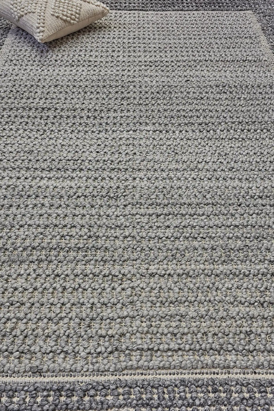 Liberty Slate is an eco-luxury rug crafted with hand woven recycled PET (plastic bottles) yarn. Boasting a super soft textured loop pile and pile height of 16-18mm. Colour Dark Grey and Grey. Sizes 160 X 230, 200 X 290, 240 X 340 and 290 X 390. Life.