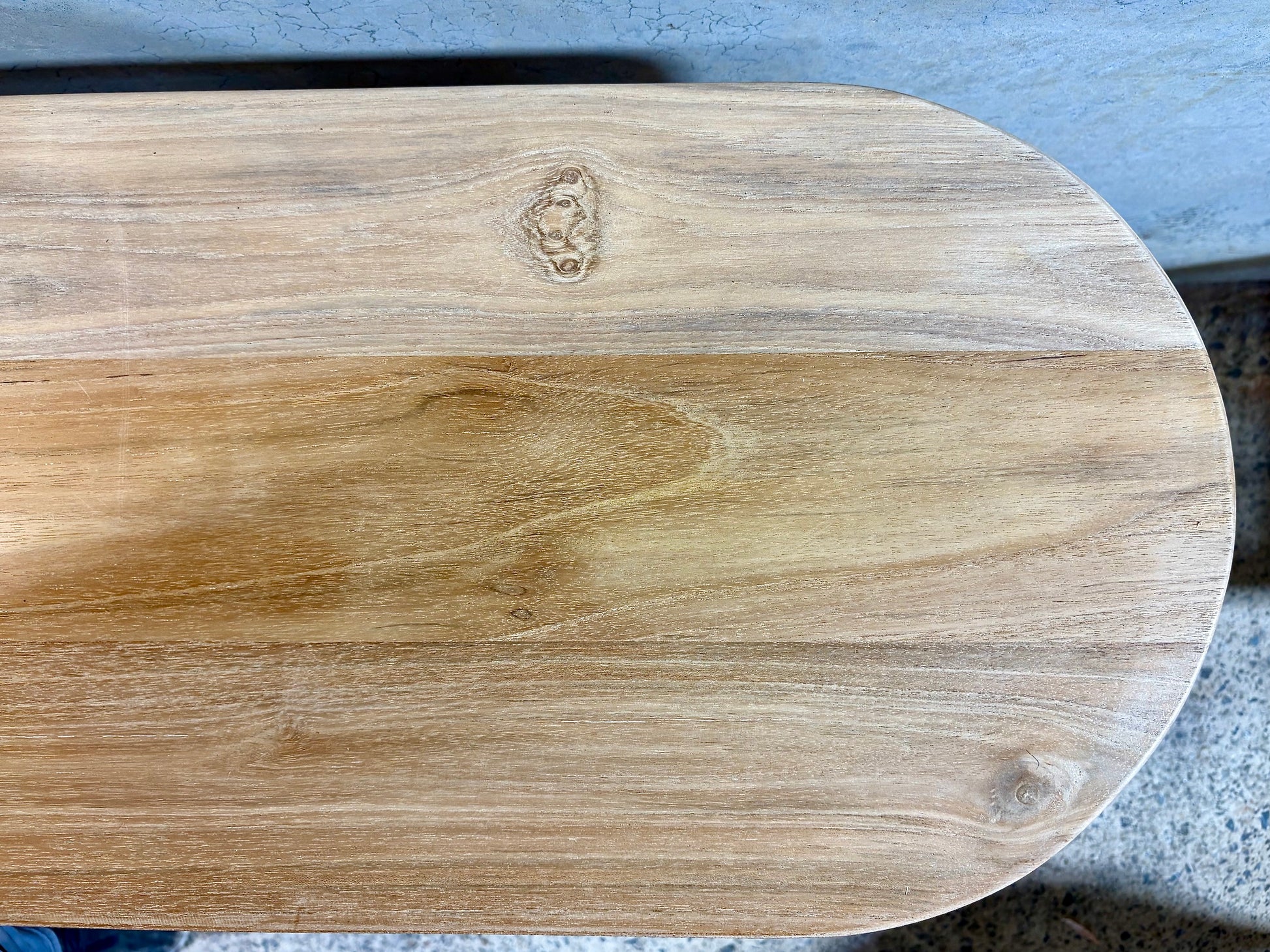 Lisbon console crafted from solid teak featuring textured cylindrical legs and solid top with rounded ends. Colour Natural Teak. Measures 1200 Wide X 350 Depth X 800 Height. Top End.