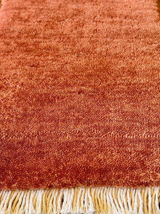 Lori Brick is a luxurious hand loomed floor rug made of 100% wool. The wool material creates a soft texture and a smooth pile height of 16-18mm. Colour orangish/redish terracotta with cream tassels. Sizes 160 X 230, 200 X 290, 240 X 340 and 300 X 400. Close edge.