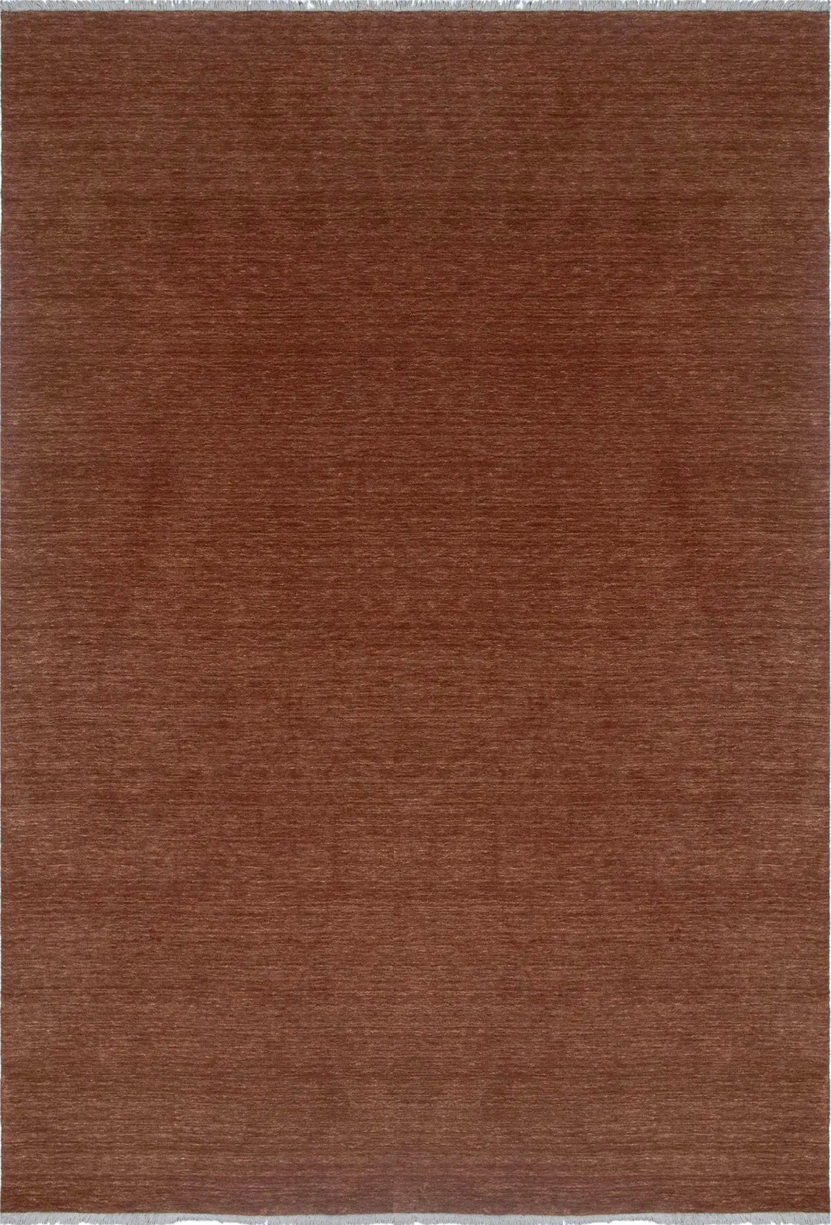 Lori Brick is a luxurious hand loomed floor rug made of 100% wool. The wool material creates a soft texture and a smooth pile height of 16-18mm. Colour orangish/redish terracotta with cream tassels. Sizes 160 X 230, 200 X 290, 240 X 340 and 300 X 400. Top view.