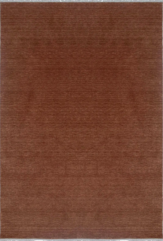 Lori Brick is a luxurious hand loomed floor rug made of 100% wool. The wool material creates a soft texture and a smooth pile height of 16-18mm. Colour orangish/redish terracotta with cream tassels. Sizes 160 X 230, 200 X 290, 240 X 340 and 300 X 400. Top view.