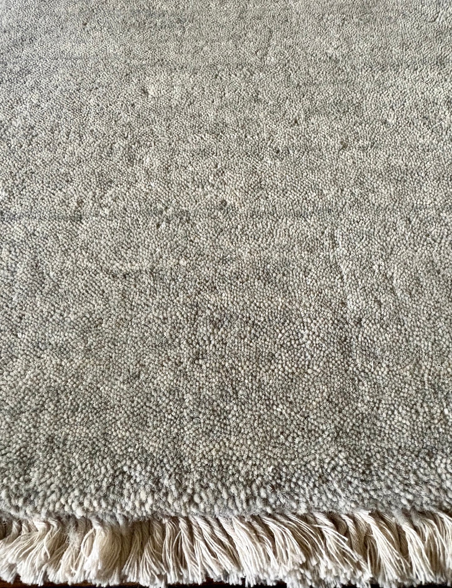 Lori Light Grey is a luxurious hand loomed floor rug made of 100% wool. The wool material creates a soft texture and a smooth pile height of 16-18mm. Colour Light Grey with cream tassels. Sizes 160 X 230, 200 X 290, 240 X 340 and 300 X 400. Close edge.