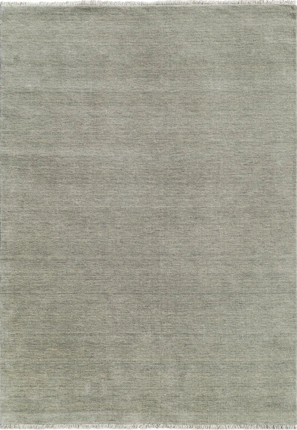 Lori Light Grey is a luxurious hand loomed floor rug made of 100% wool. The wool material creates a soft texture and a smooth pile height of 16-18mm. Colour Light Grey with cream tassels. Sizes 160 X 230, 200 X 290, 240 X 340 and 300 X 400. Top view.