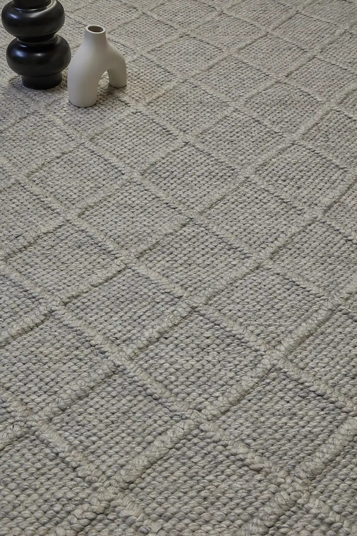 Lounge Aluminium is a luxurious wool and bamboo silk rug, featuring a modern Scandinavian Diamond Pattern design and textured hand loomed pile. With pile height of 16-18mm. Colour Aluminium Grey. Sizes 160 X 230, 200 X 290 and 240 X 340. Life.