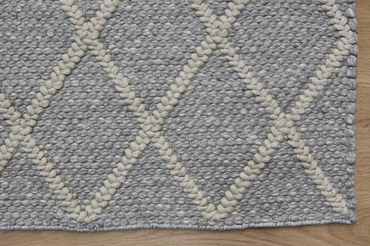 Lounge Silver is a luxurious wool and bamboo silk rug, featuring a modern Scandinavian Diamond Pattern design and textured hand loomed pile. With pile height of 16-18mm. Colour Silver Grey with beige diamond pattern.Sizes 160 X 230, 200 X 290 and 240 X340. Corner.