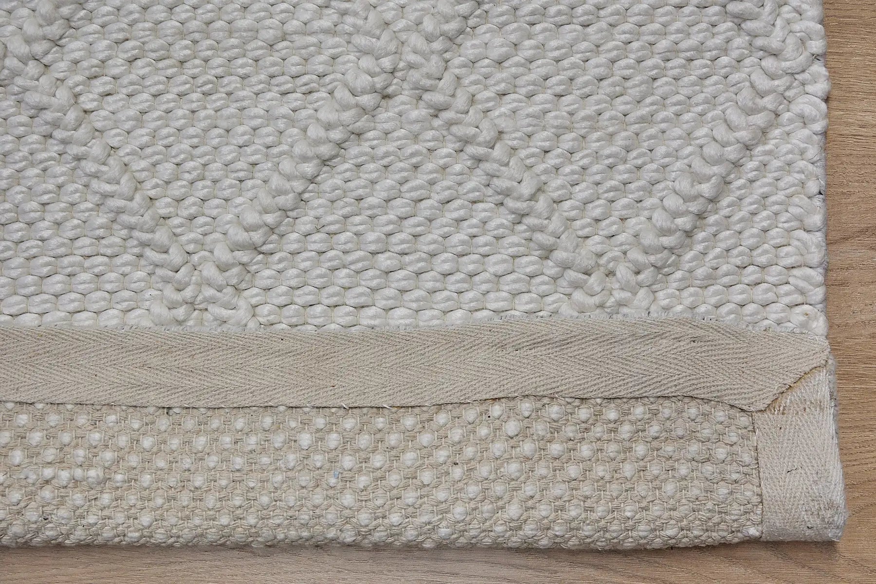 Lounge White is a luxurious wool and bamboo silk rug, featuring a modern Scandinavian Diamond Pattern design and textured hand loomed pile. With pile height of 16-18mm. Colour White with white diamond pattern. Sizes 160 X 230, 200 X 290 and 240 X 340. Fold.