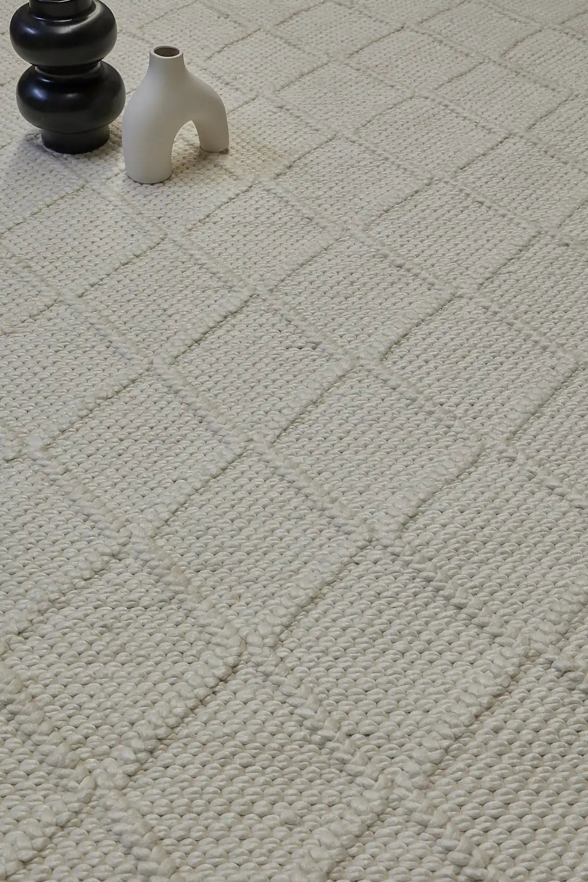 Lounge White is a luxurious wool and bamboo silk rug, featuring a modern Scandinavian Diamond Pattern design and textured hand loomed pile. With pile height of 16-18mm. Colour White with white diamond pattern. Sizes 160 X 230, 200 X 290 and 240 X 340. Life.