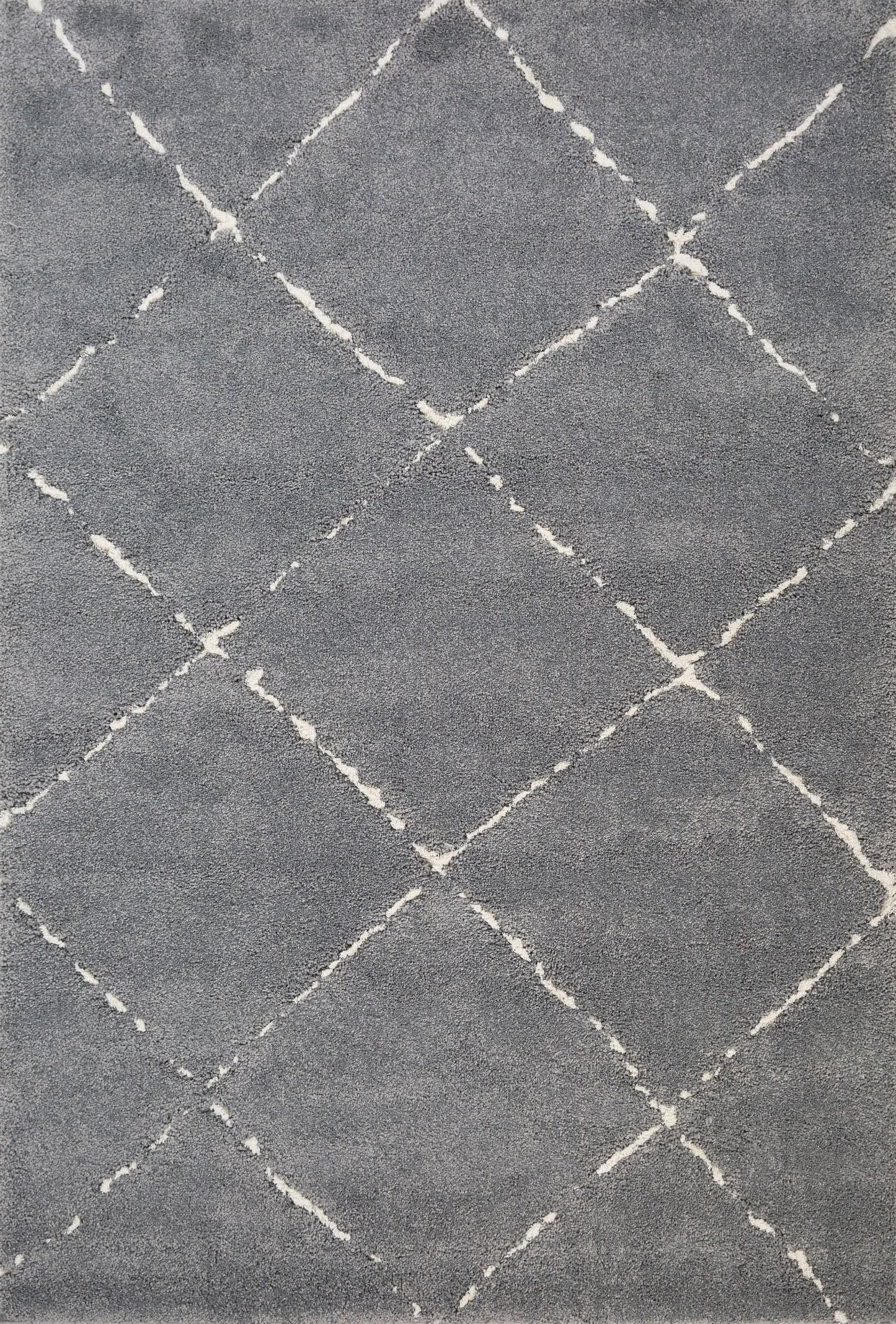 Luana Grey Ivory 4155 is a machine made polypropylene rug.  It features a shaggy pile with a moroccan boho inspired design. Colours Grey with Ivory White Diamond pattern. Sizes 160 X 230, 200 X 290, 240 X 320 and 300 X 390. Full.