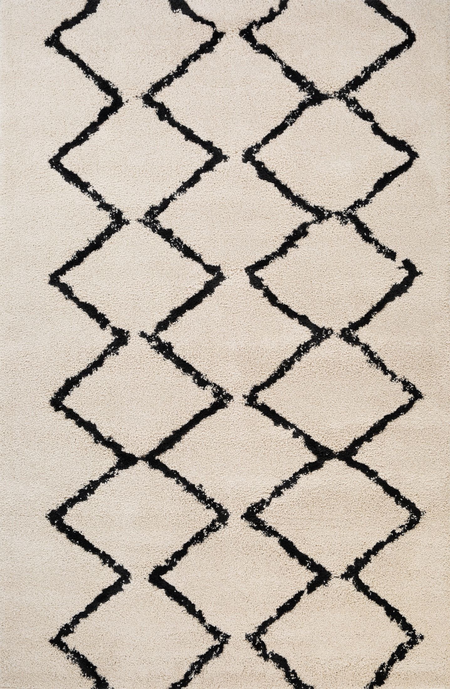 Luana Ivory Charcoal 701 is a machine made polypropylene rug.  It features a shaggy pile with a moroccan boho inspired design. Colours Ivory with a charcoal diamond pattern. Sizes 160 X 230, 200 X 290, 240 X 320 and 300 X 390. Full.