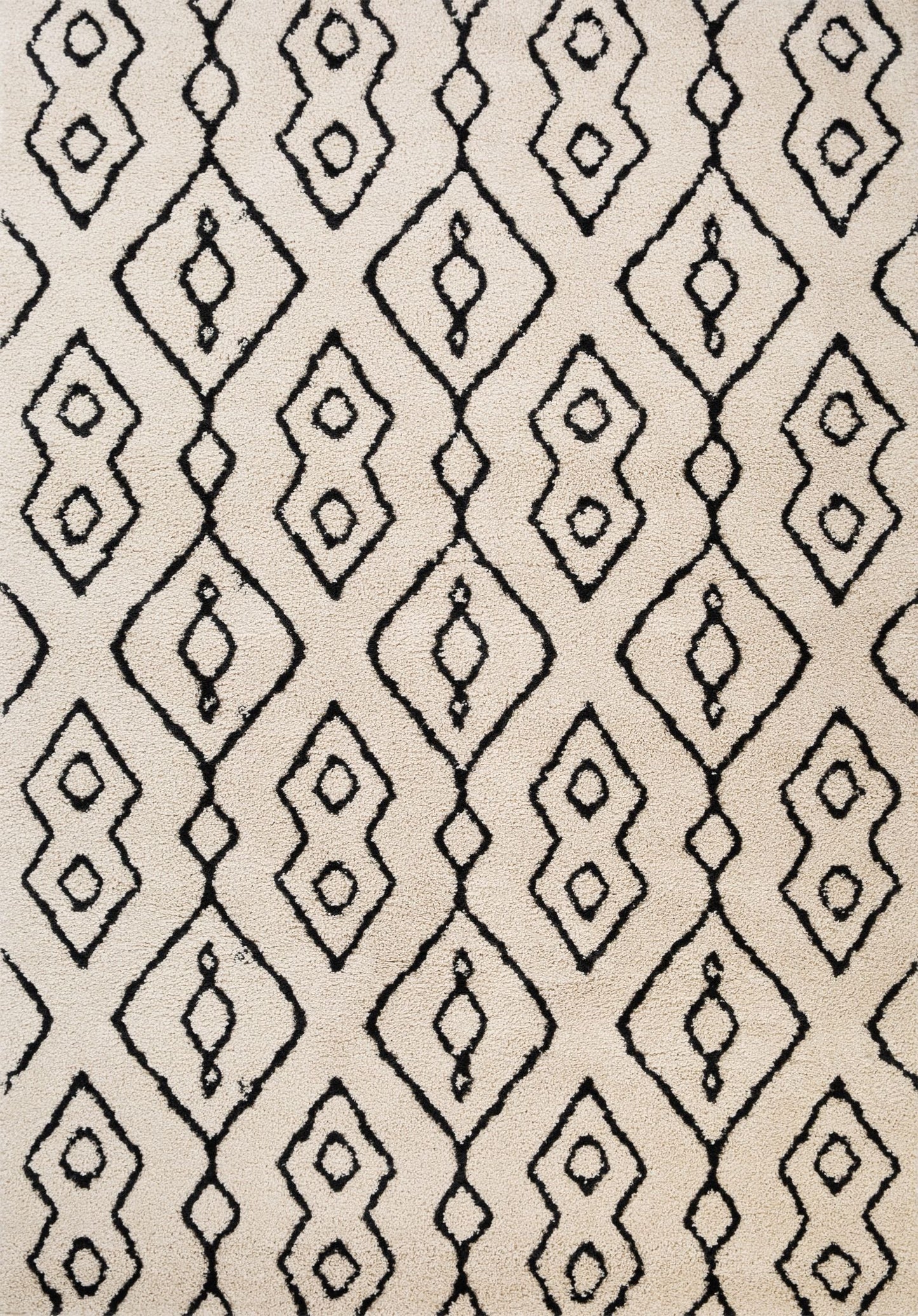 Luana Ivory Charcoal 8020 is a machine made polypropylene rug.  It features a shaggy pile with a moroccan boho inspired design. Colours Ivory with a charcoal moroccan inspired diamond pattern. Sizes 160 X 230, 200 X 290, 240 X 320 and 300 X 390. Full.
