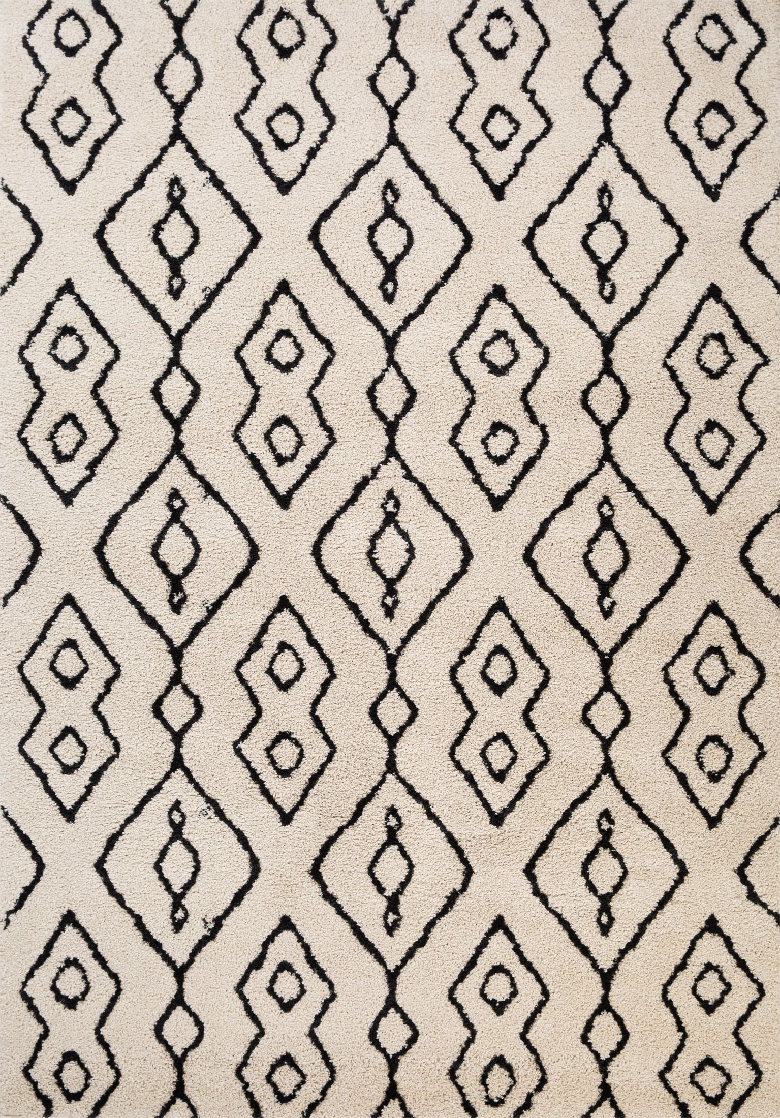 Luana Ivory Charcoal 8020 is a machine made polypropylene rug.  It features a shaggy pile with a moroccan boho inspired design. Colours Ivory with a charcoal moroccan inspired diamond pattern. Sizes 160 X 230, 200 X 290, 240 X 320 and 300 X 390. Full.