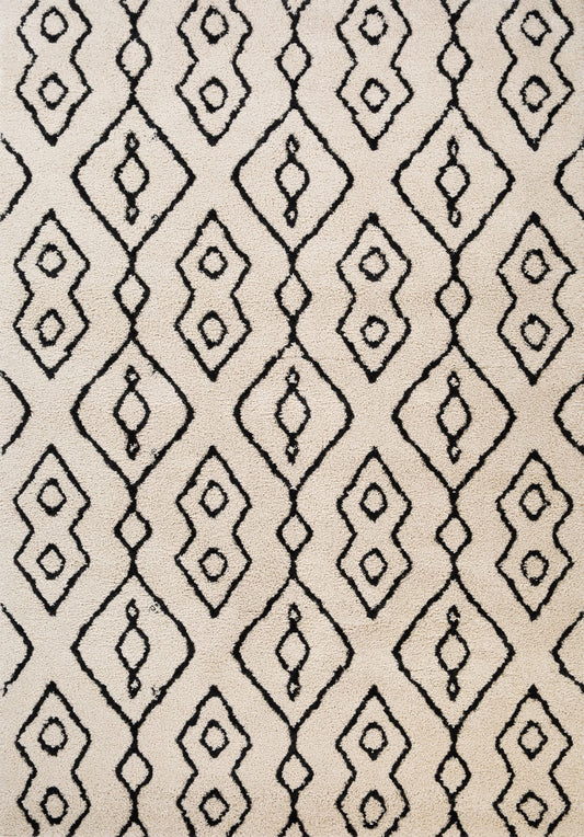 Luana Ivory Charcoal 8020 is a machine made polypropylene rug.  It features a shaggy pile with a moroccan boho inspired design. Colours Ivory with a charcoal moroccan inspired diamond pattern. Sizes 160 X 230, 200 X 290, 240 X 320 and 300 X 390. Full.