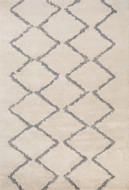 Luana Ivory Grey 701 is a machine made polypropylene rug.  It features a shaggy pile with a moroccan boho inspired design. Colours Ivory with a grey diamond pattern. Sizes 160 X 230, 200 X 290, 240 X 320 and 300 X 390. Full.