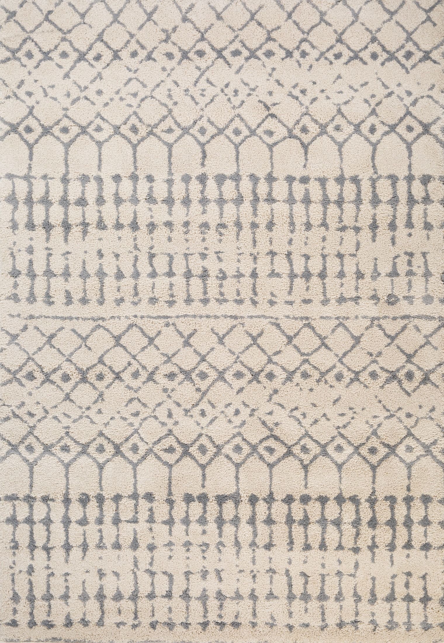 Luana Ivory Grey 71 is a machine made polypropylene rug.  It features a shaggy pile with a moroccan boho inspired design. Colours Ivory with grey moroccan inspired patterns. Sizes 160 X 230, 200 X 290, 240 X 320 and 300 X 390. Full.