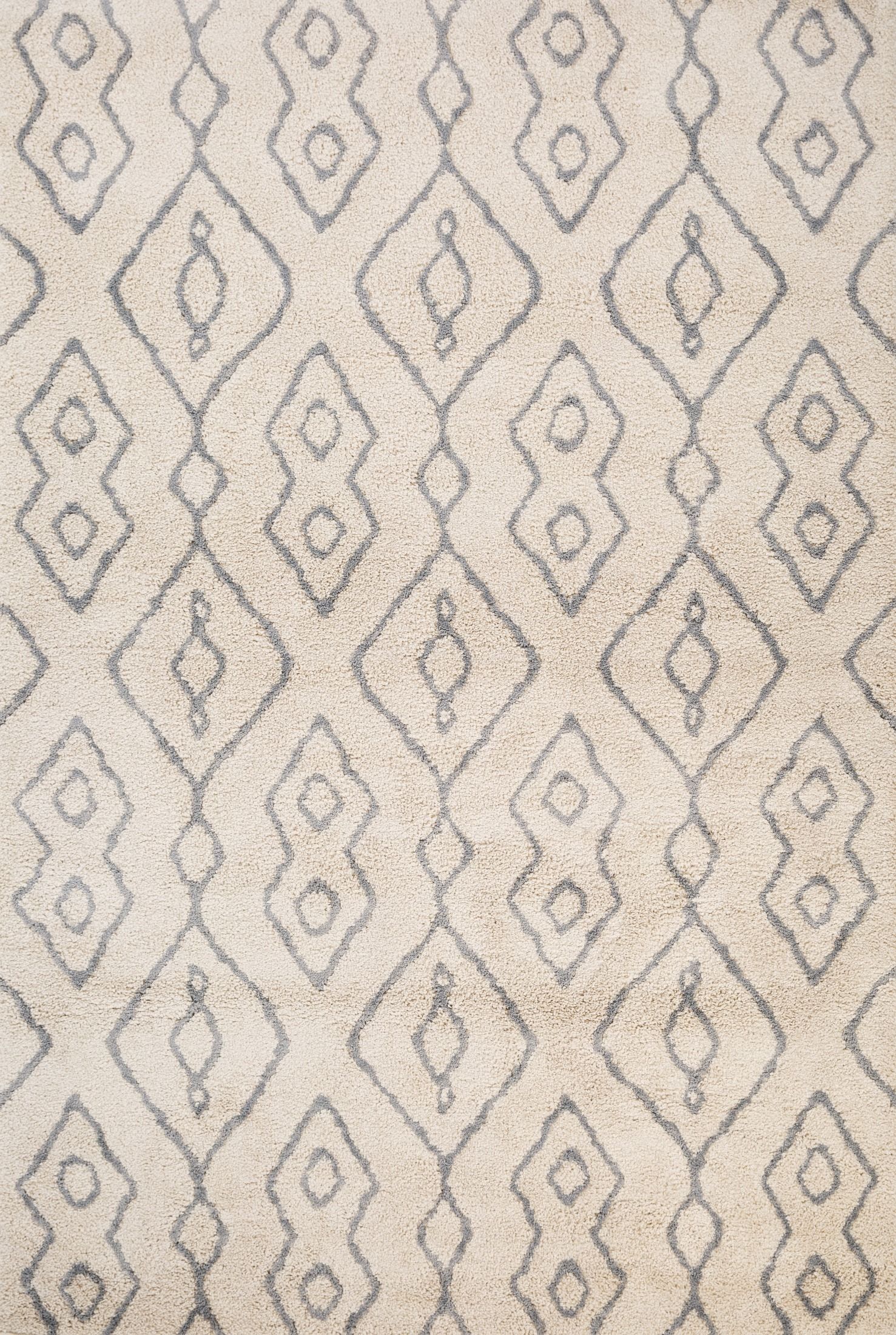 Luana Ivory Grey 8020 is a machine made polypropylene rug.  It features a shaggy pile with a moroccan boho inspired design. Colours Ivory with grey moroccan inspired diamond patterns. Sizes 160 X 230, 200 X 290, 240 X 320 and 300 X 390. Full.