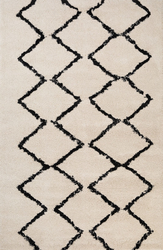 Luana Classic Ivory Charcoal is a machine made polypropylene rug.  It features a shaggy pile with a moroccan boho inspired design. Colours Ivory with a charcoal diamond pattern. Sizes 160 X 230, 200 X 290, 240 X 320 and 300 X 390. Top.
