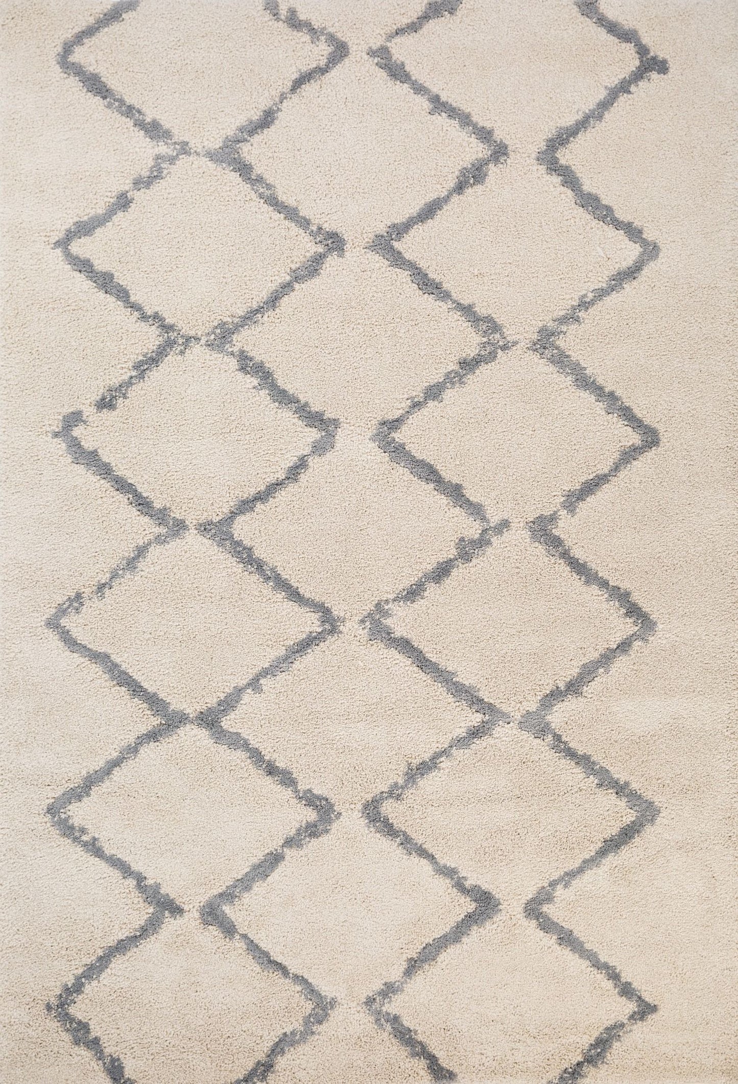 Luana Classic Ivory Grey is a machine made polypropylene rug.  It features a shaggy pile with a moroccan boho inspired design. Colours Ivory with a grey diamond pattern. Sizes 160 X 230, 200 X 290, 240 X 320 and 300 X 390. Top.