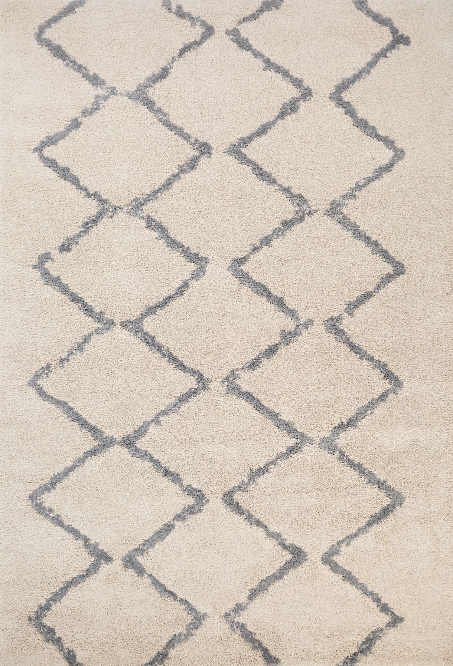 Luana Classic Ivory Grey is a machine made polypropylene rug.  It features a shaggy pile with a moroccan boho inspired design. Colours Ivory with a grey diamond pattern. Sizes 160 X 230, 200 X 290, 240 X 320 and 300 X 390. Top.